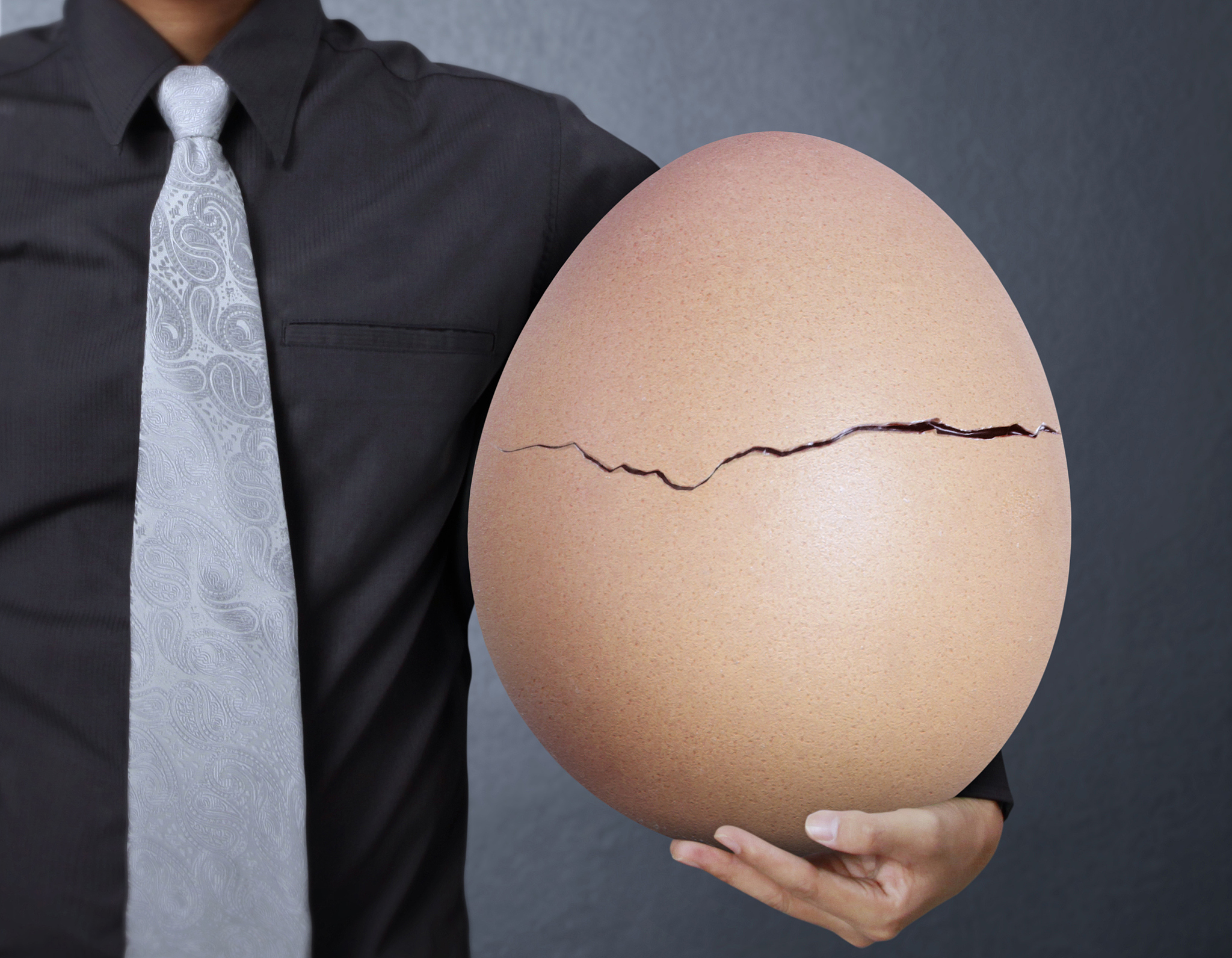 holding one egg in hands