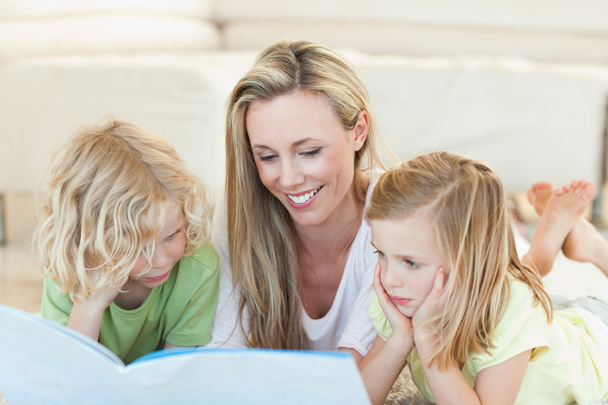 mother reading story for her children