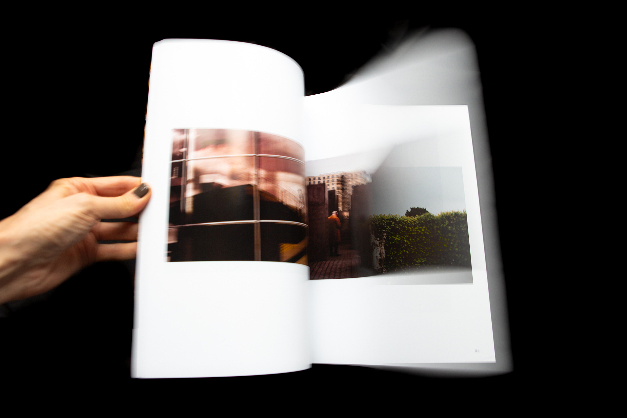 looking through magazine, turning pages