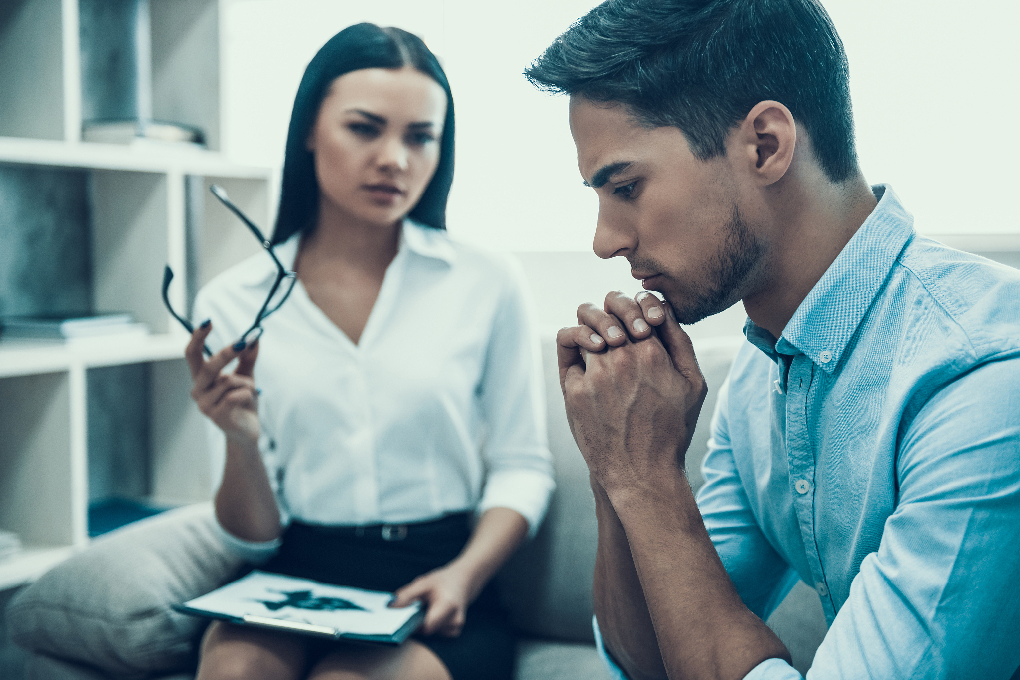 young upset man at psychologist reception.
