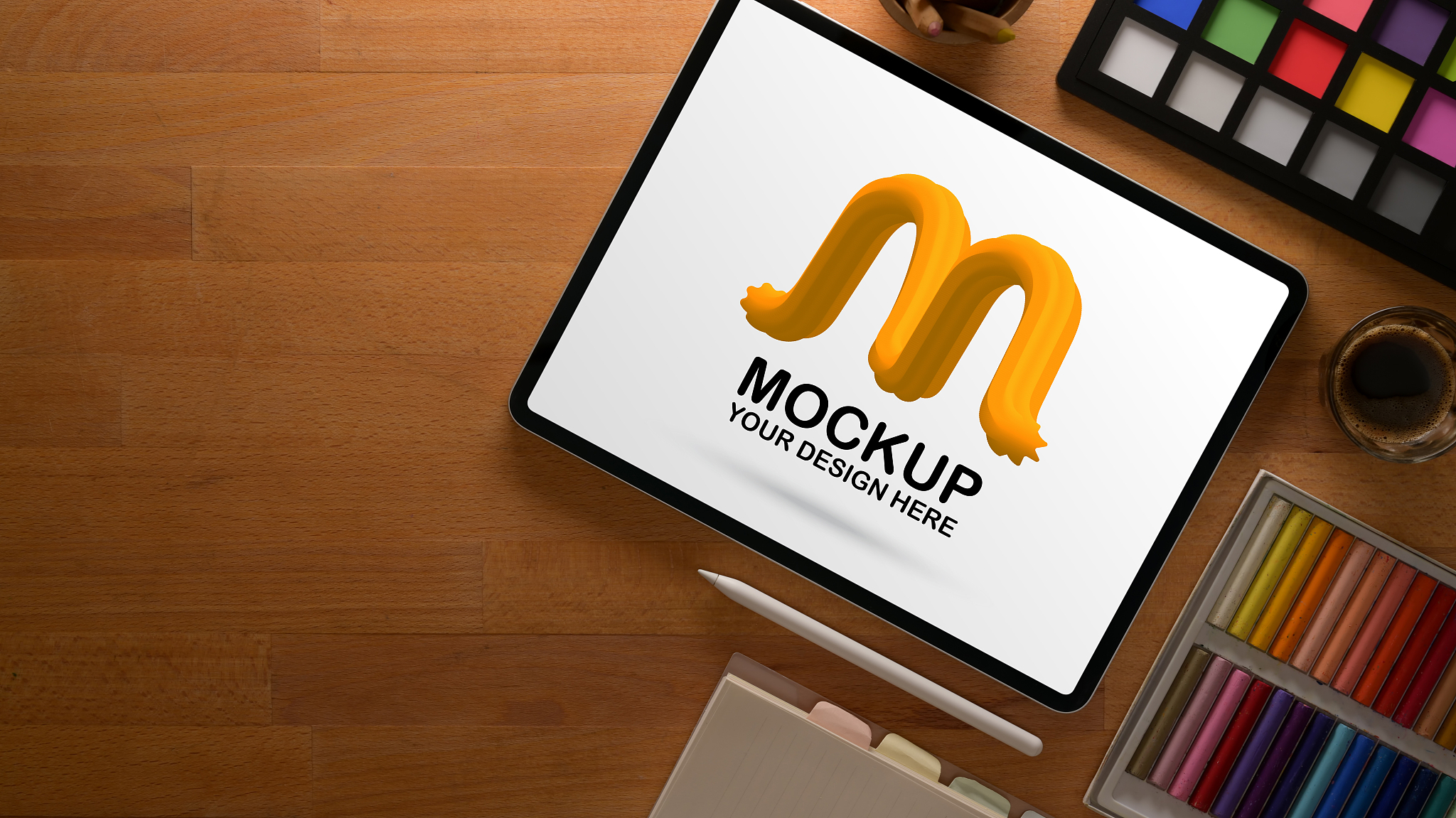 designer workspace with mock up tablet, paint tools and copy spa