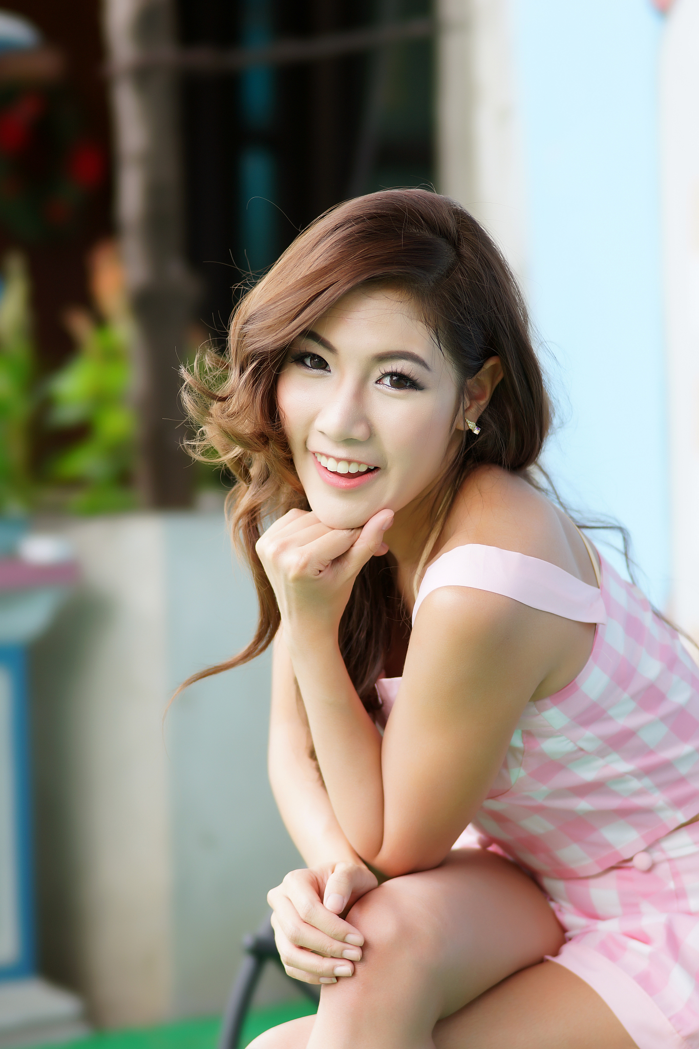 beautiful young woman posing alone at the outdoor cafe