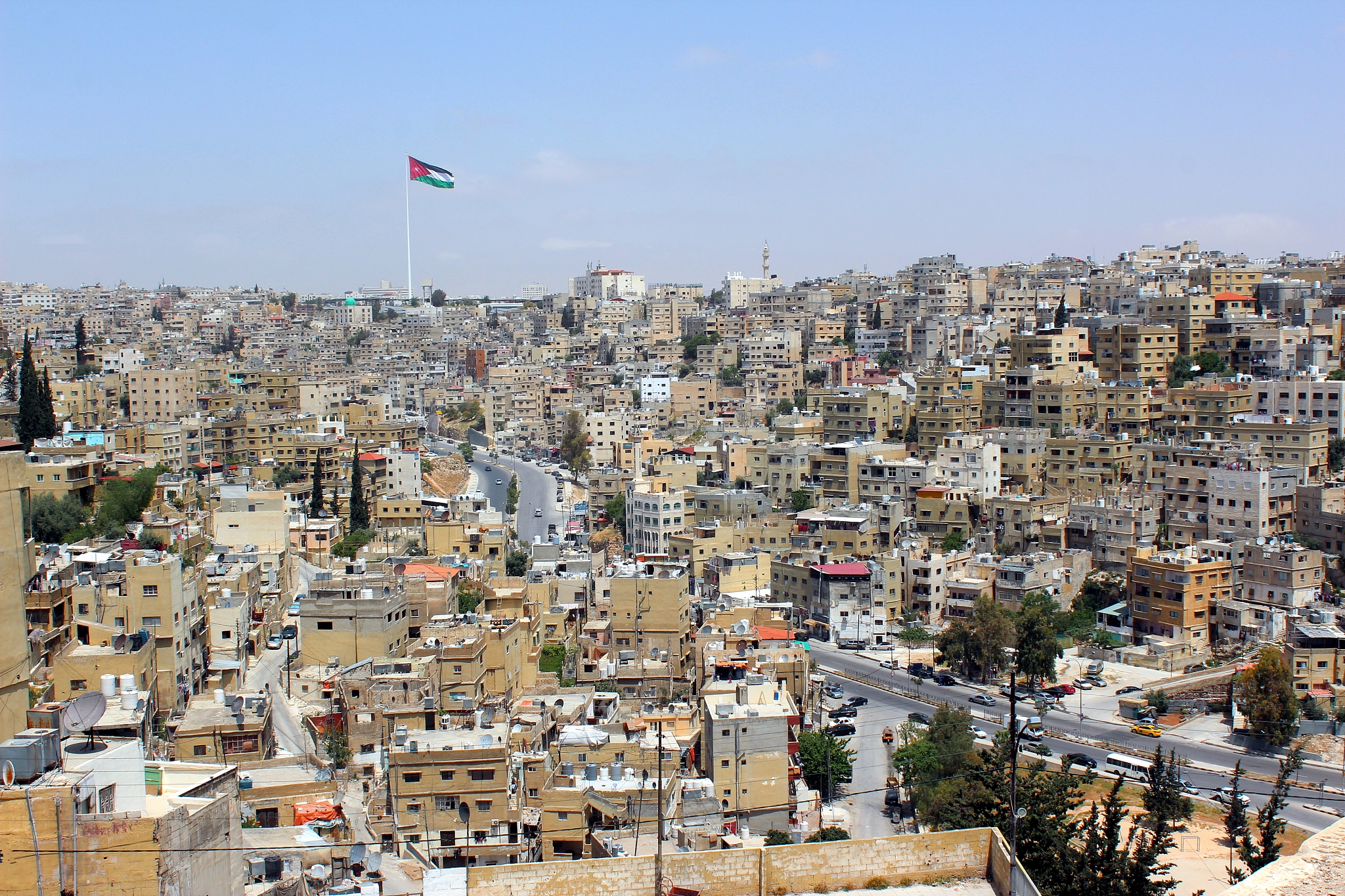 amman city view with big jordan flag, amman