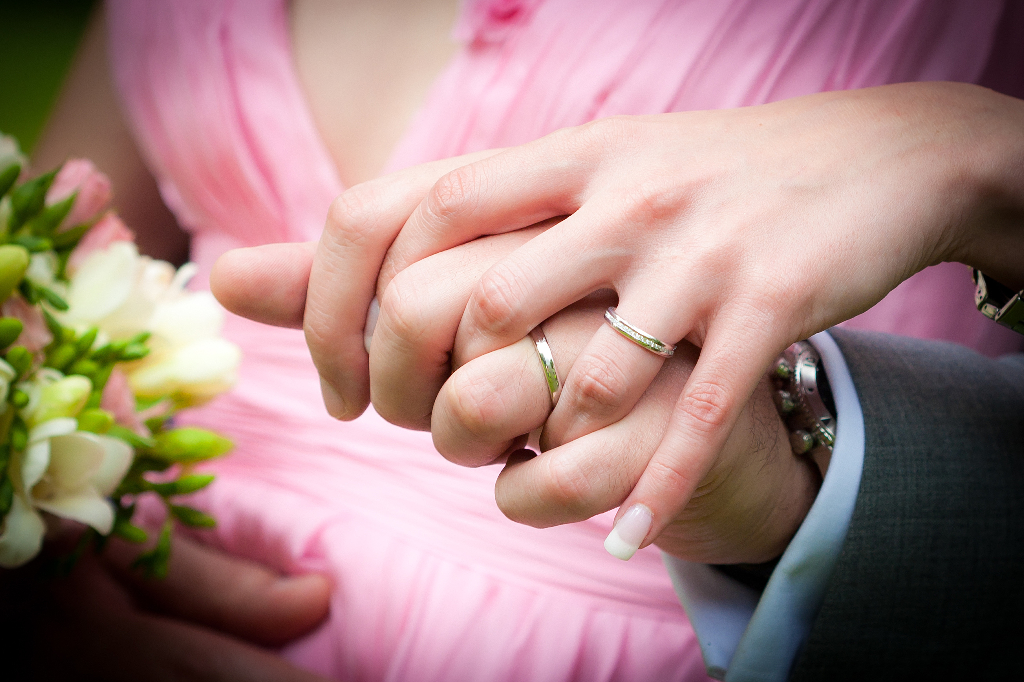 young married couple holding hands
