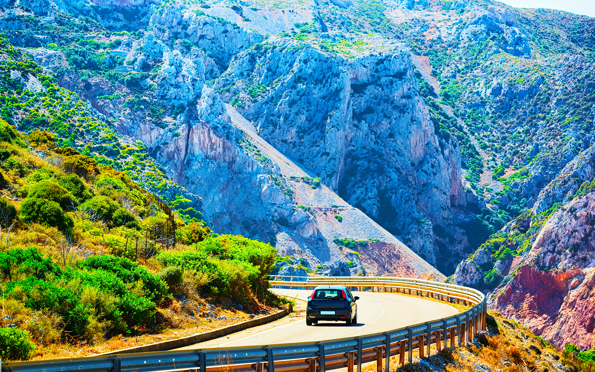 car on road at buggerru in carbonia iglesias sardinia reflex