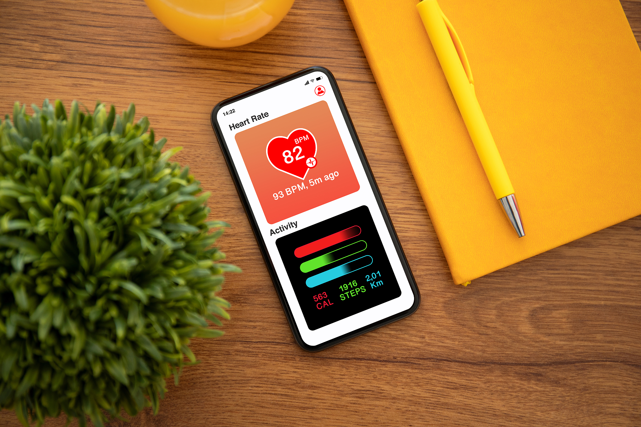 touch phone with app heart and activity on the screen