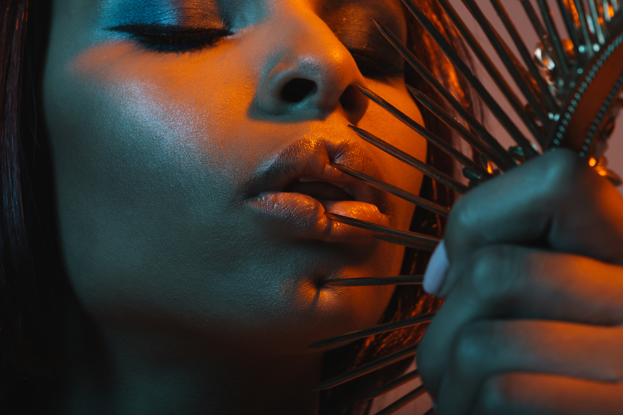 portrait of young african american girl touching lips with dange