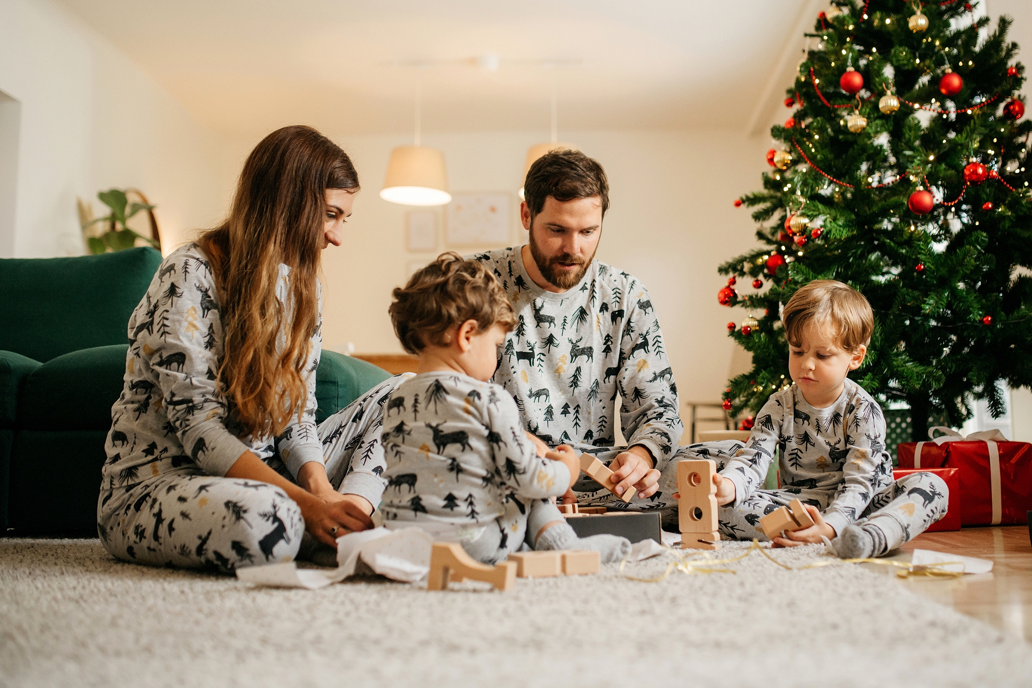 family unwrapping christmas gifts