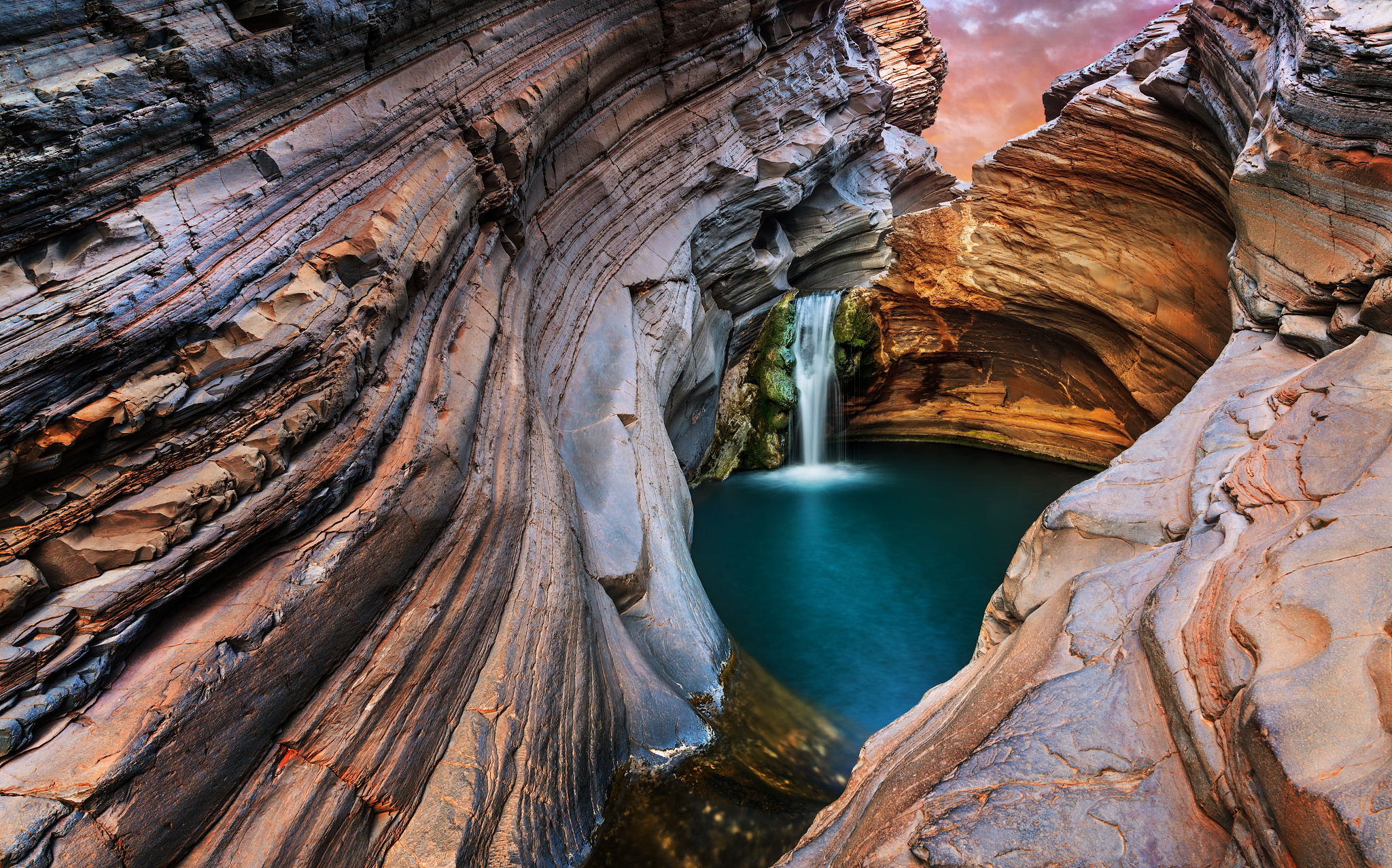 waterfall cascading into a canyon.