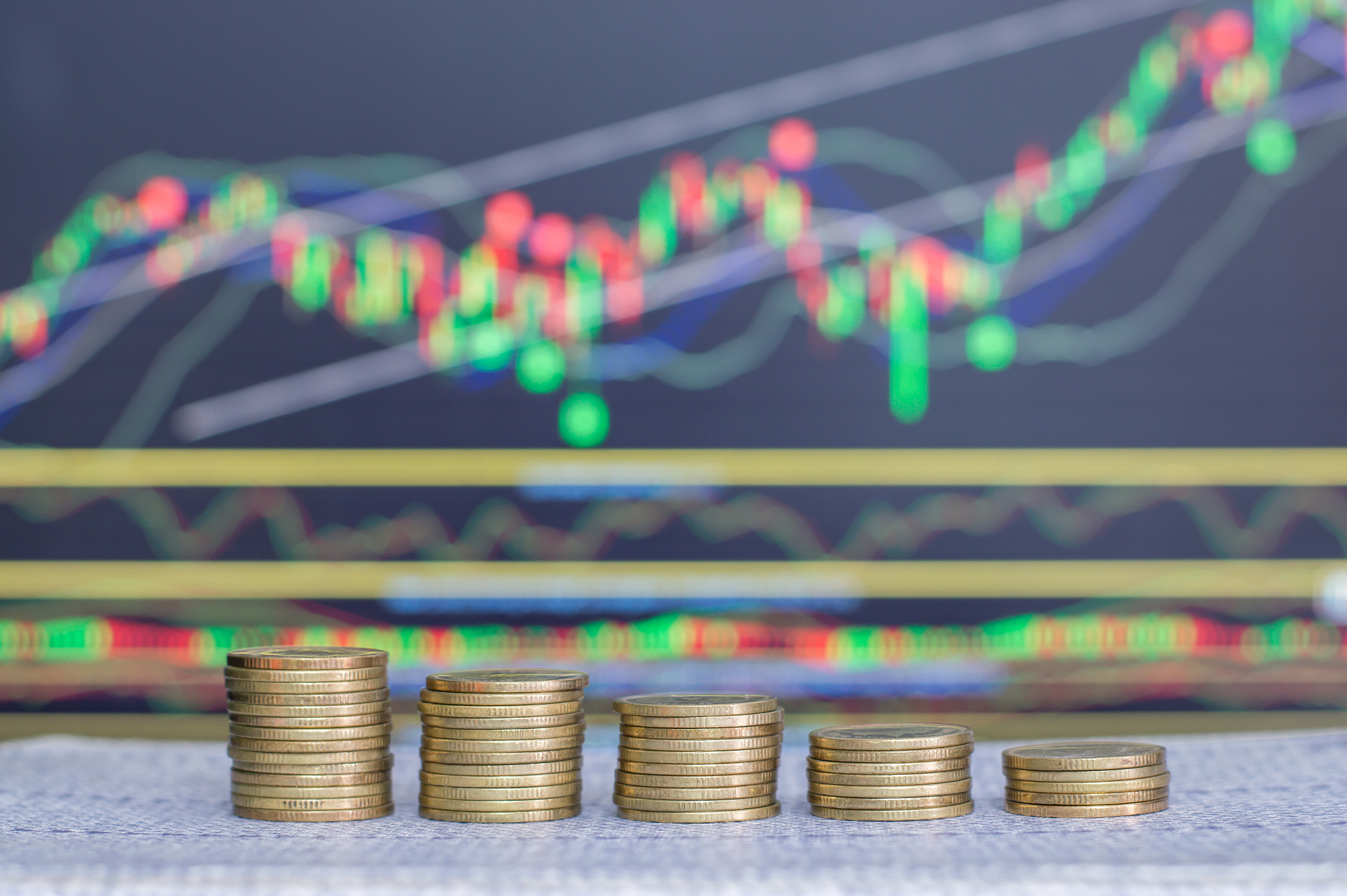 investment concept, coins, graph stock market background, thai m