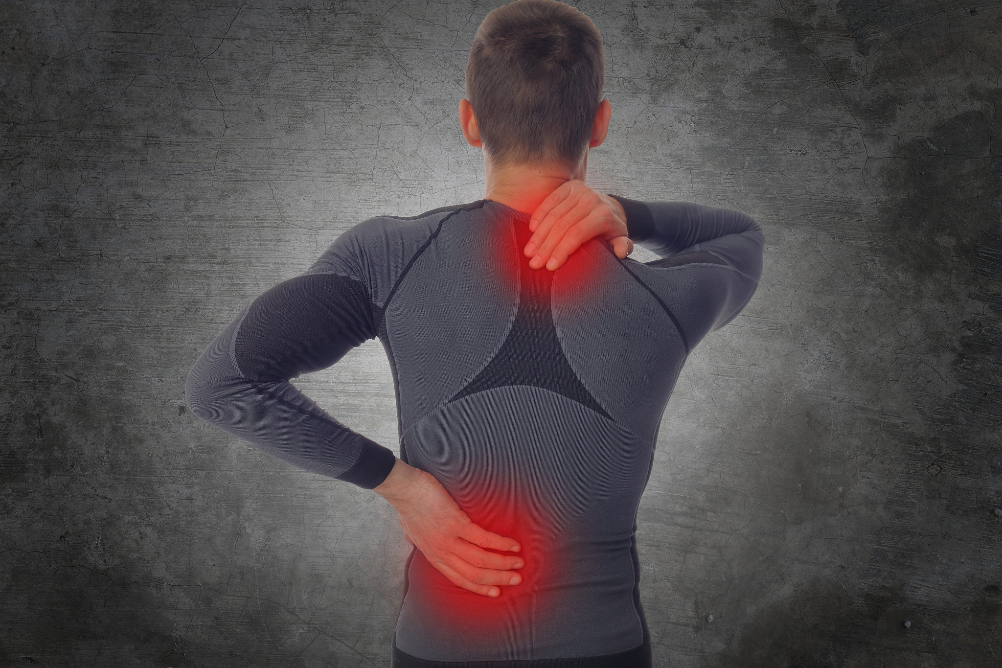sport injury, man with back, neck pain. pain relief concept.