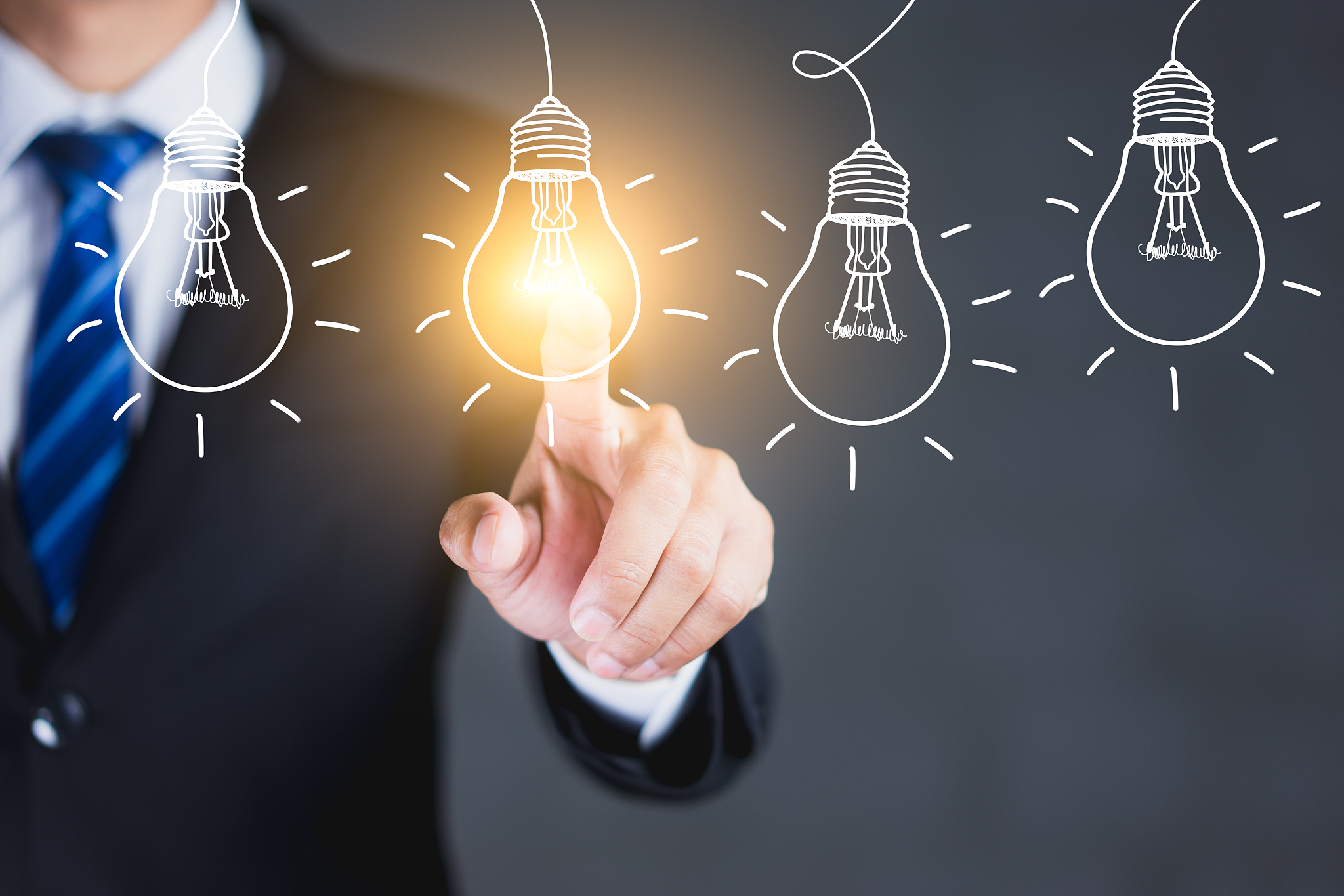 businessman hand touching light bulbs, new ideas with innovative