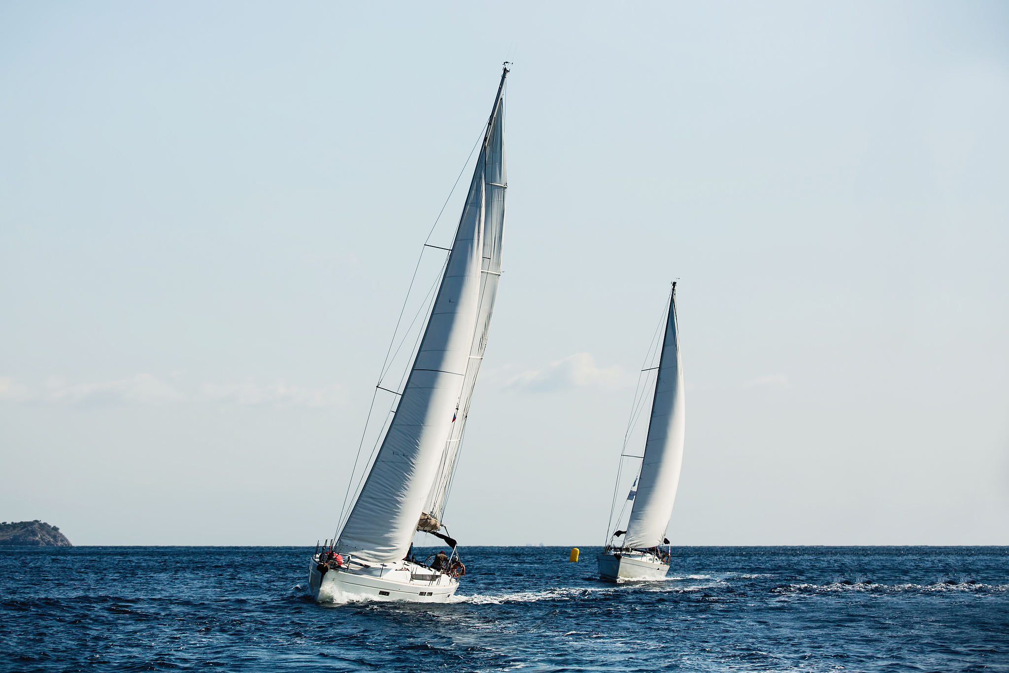 yachts ship with white sails in the sea at sailing regatta.