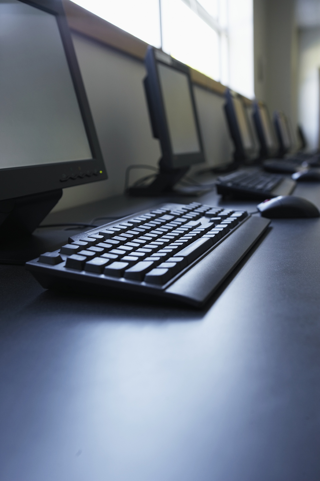 row of computers on table