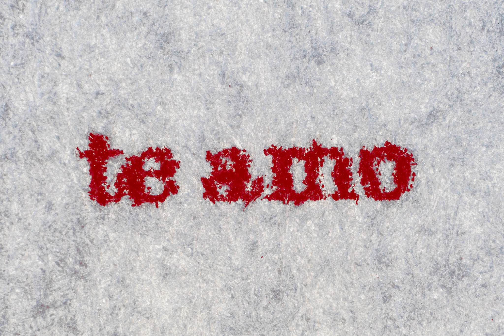 extreme macro shot of the word te amo typed on white paper. grun