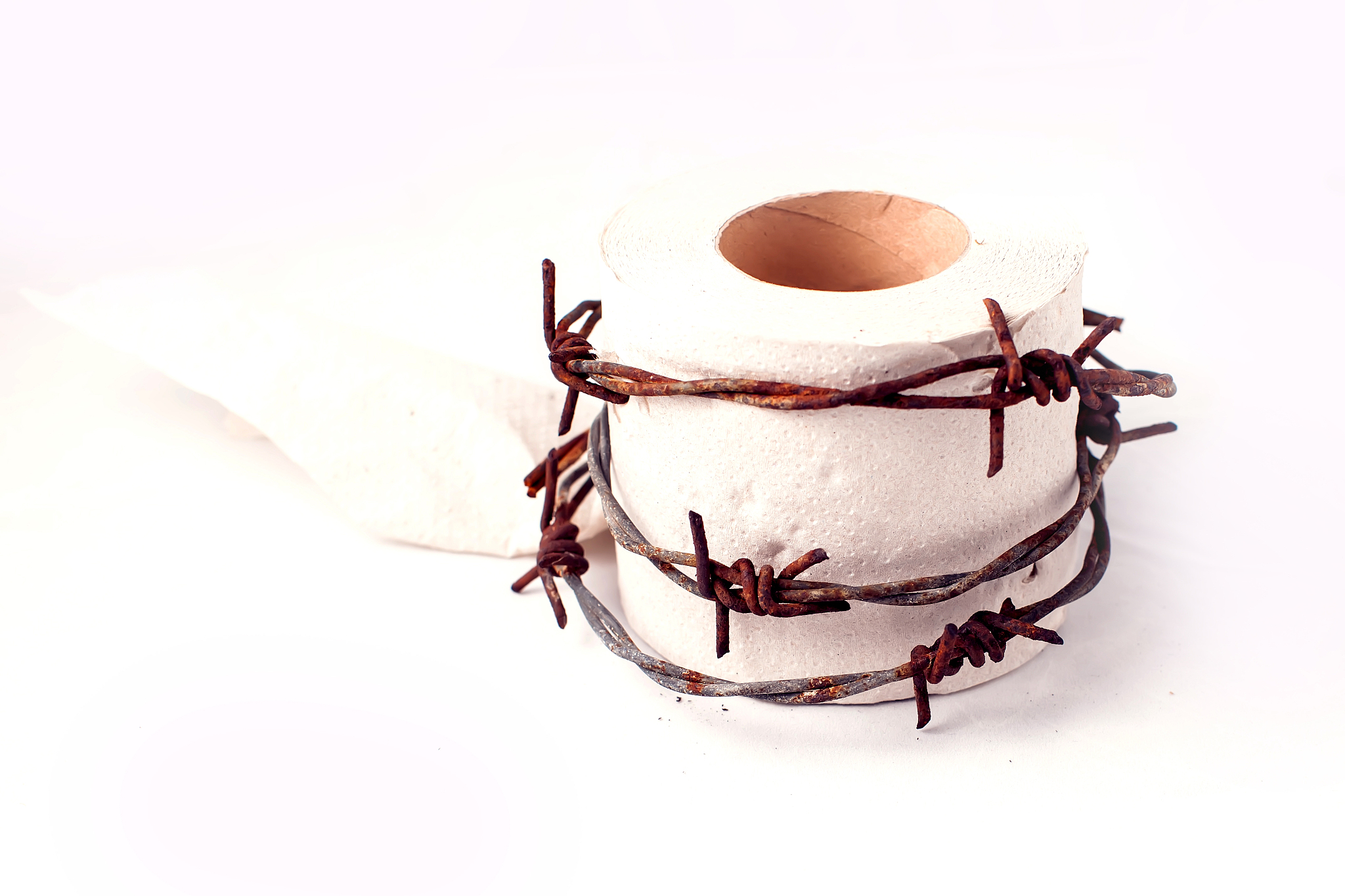 toilet paper with barbed wire around it. people, healthcare and 