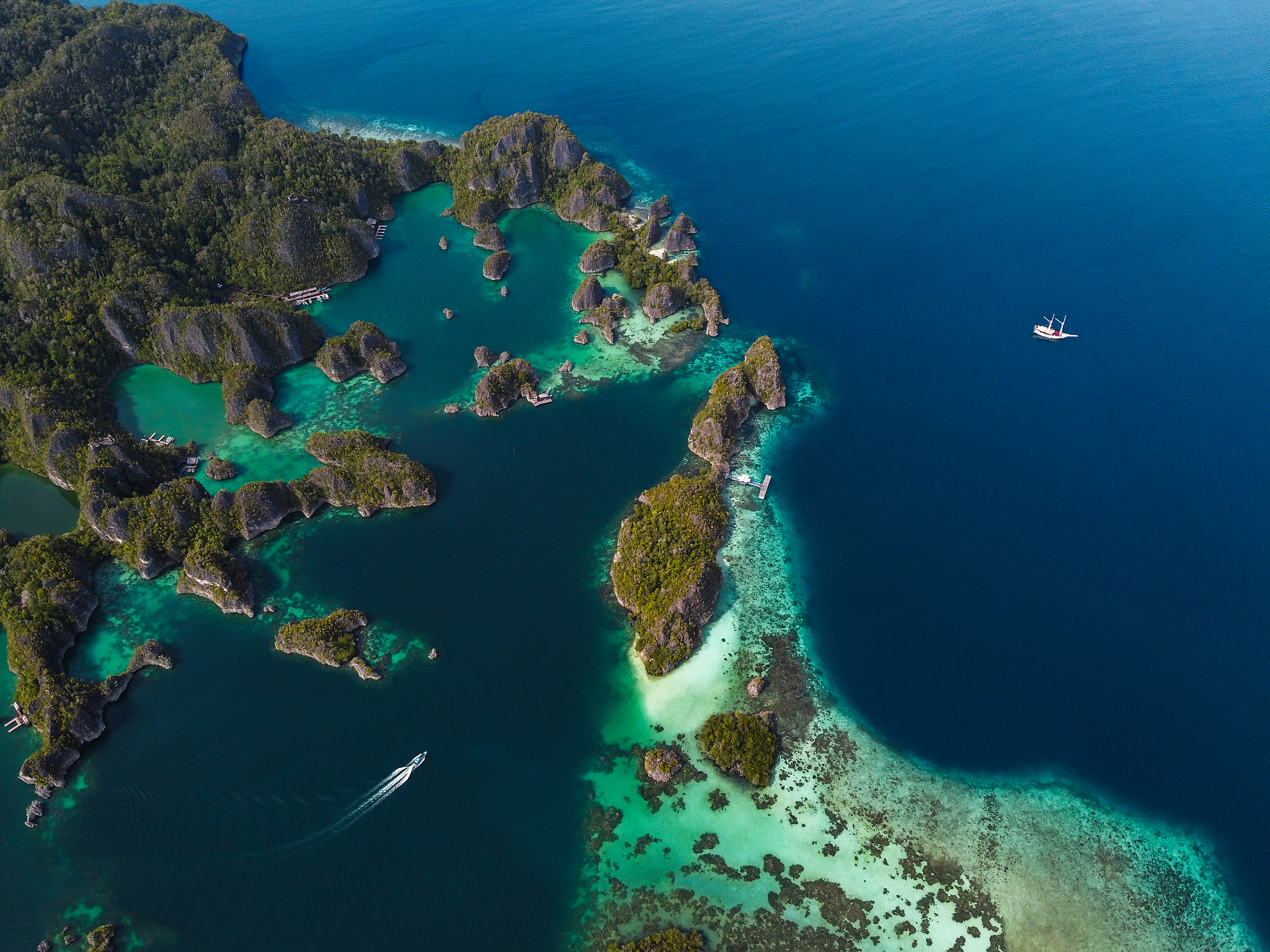 aerial view of sailboat and island archipelago