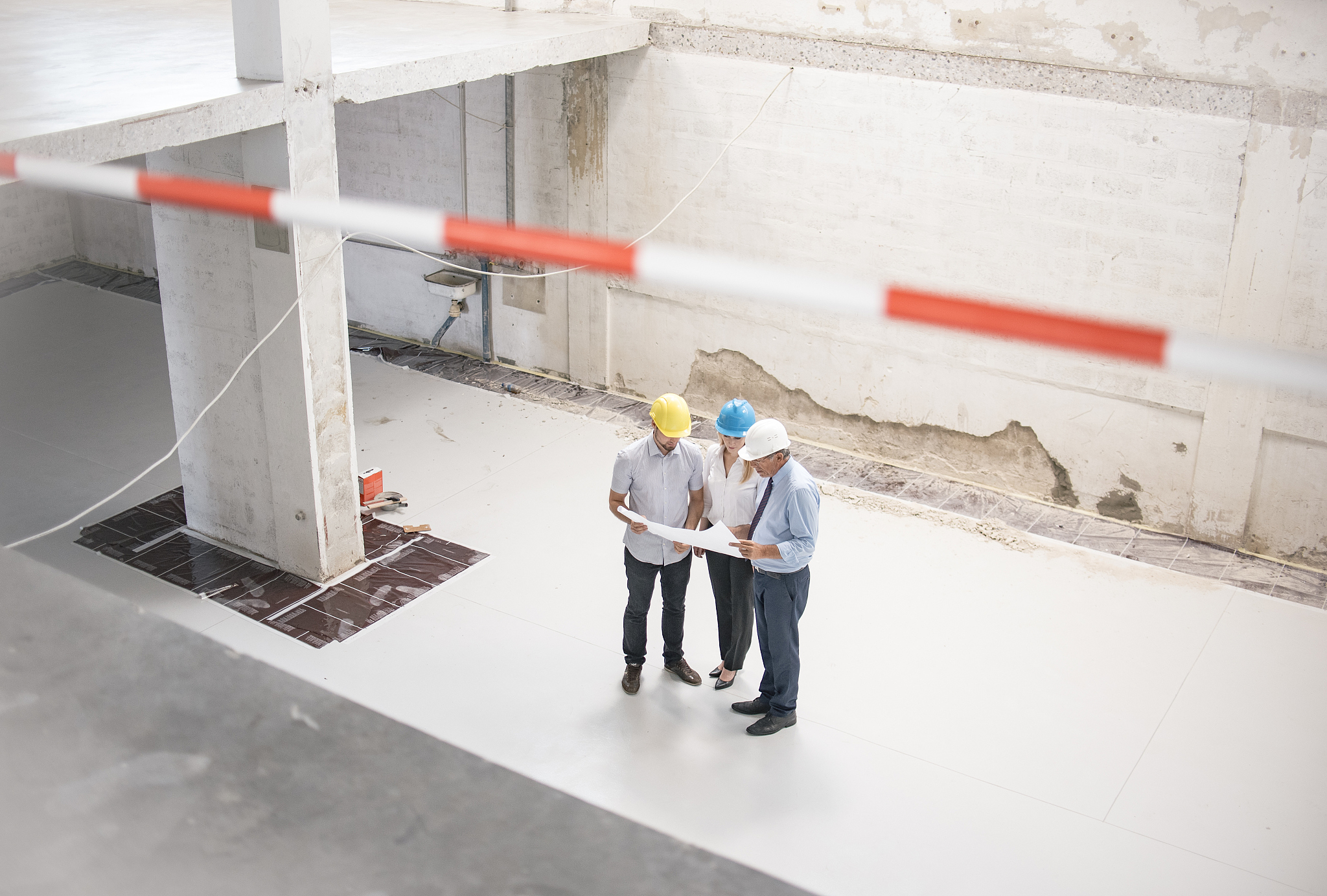 group of engineers and architects supervising construction
