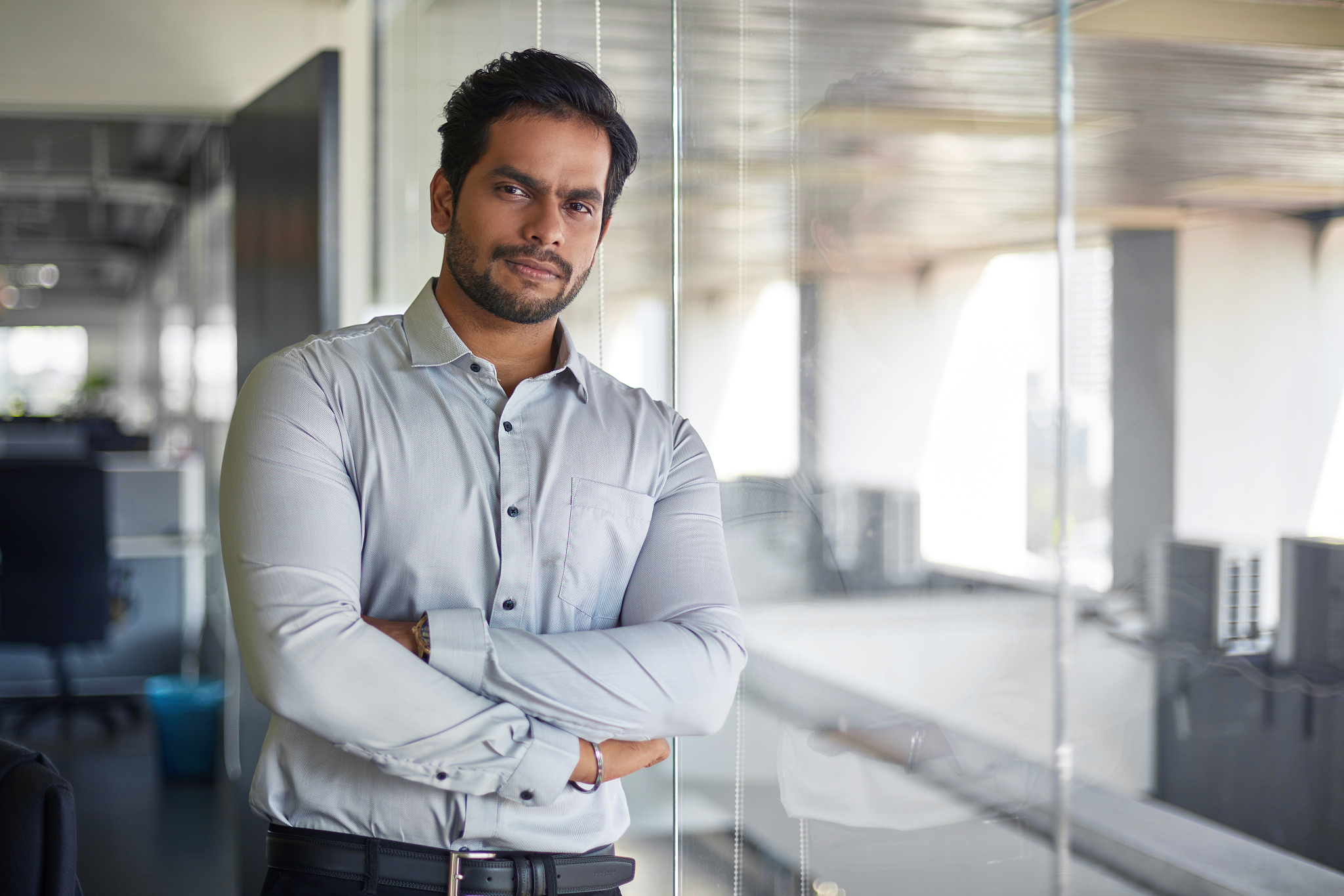 portrait of malaysian indian young businessman at office