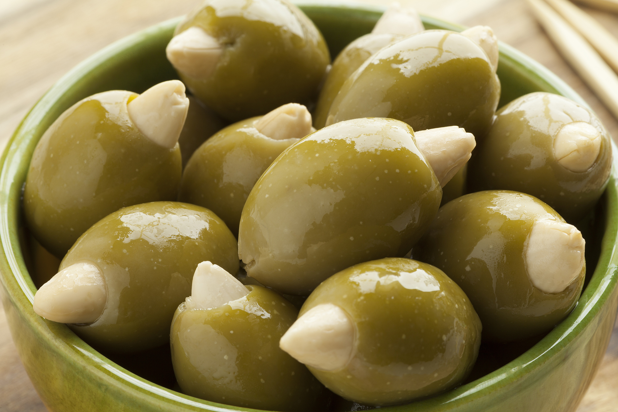 bowl with olives stuffed with an almond