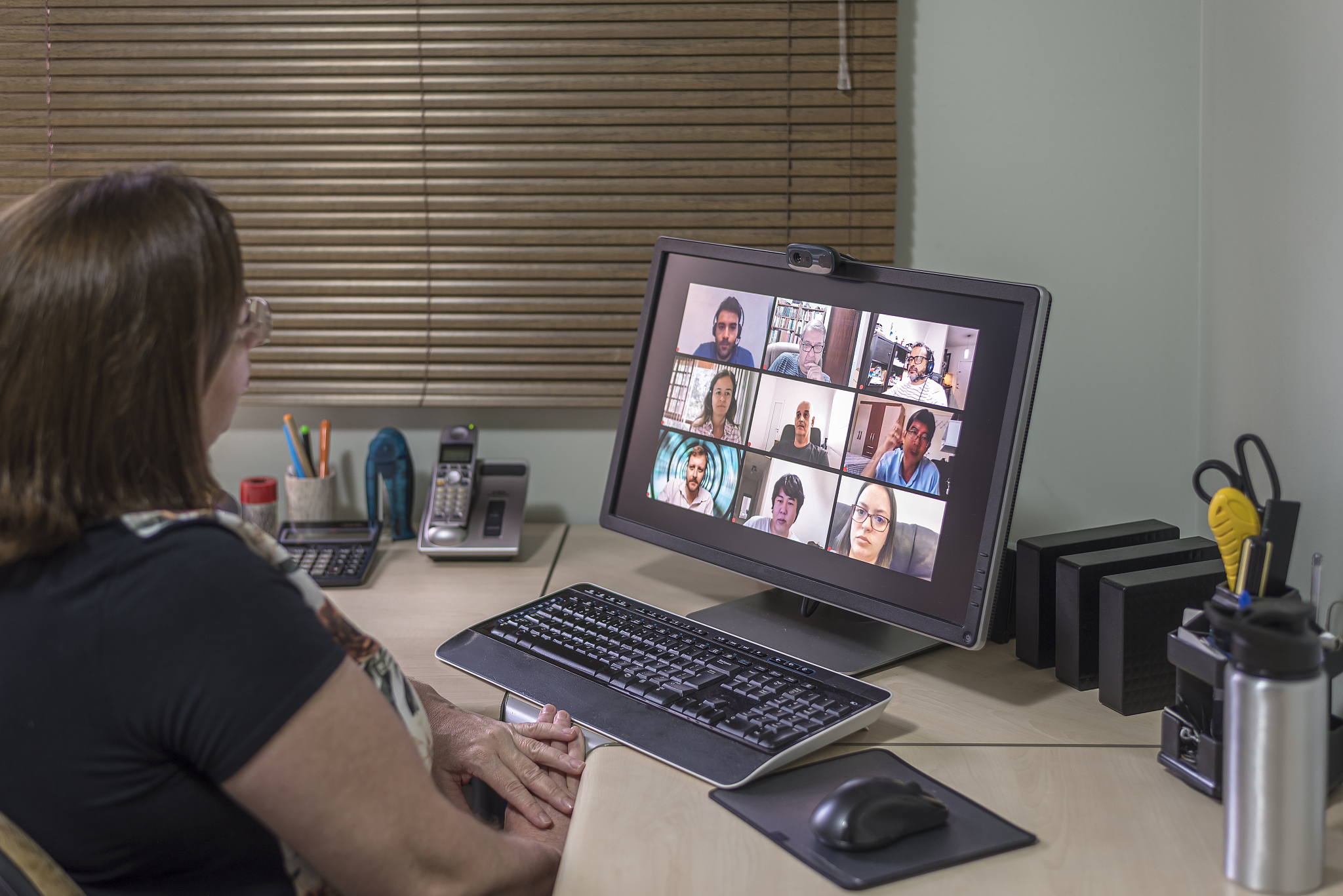 adult woman making conference call with friends