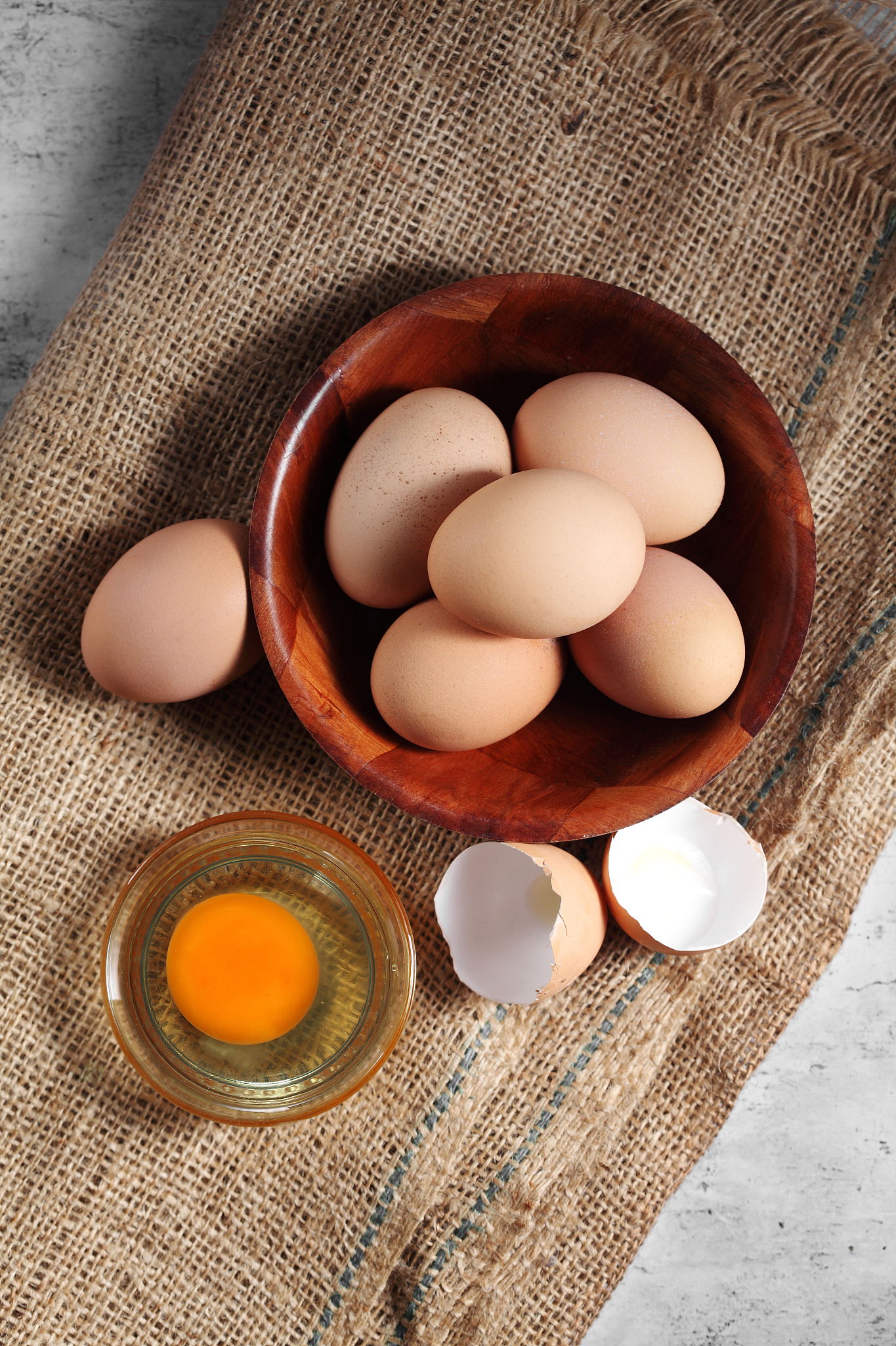 group of of raw chicken eggs on rustic background, ingredient fo