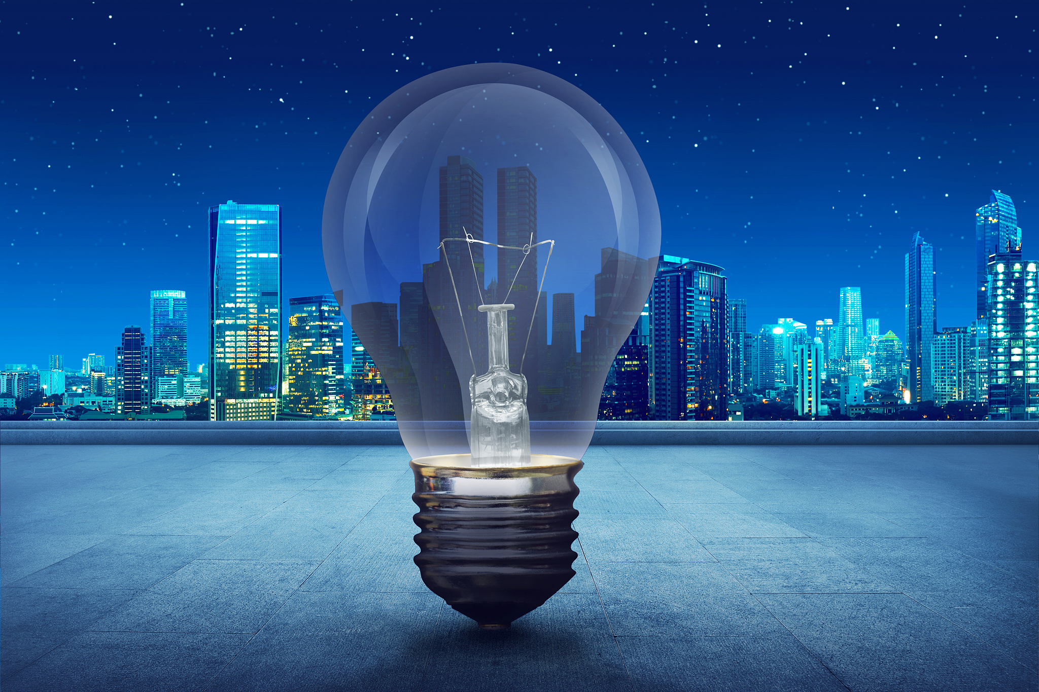 light bulb on building balcony on city