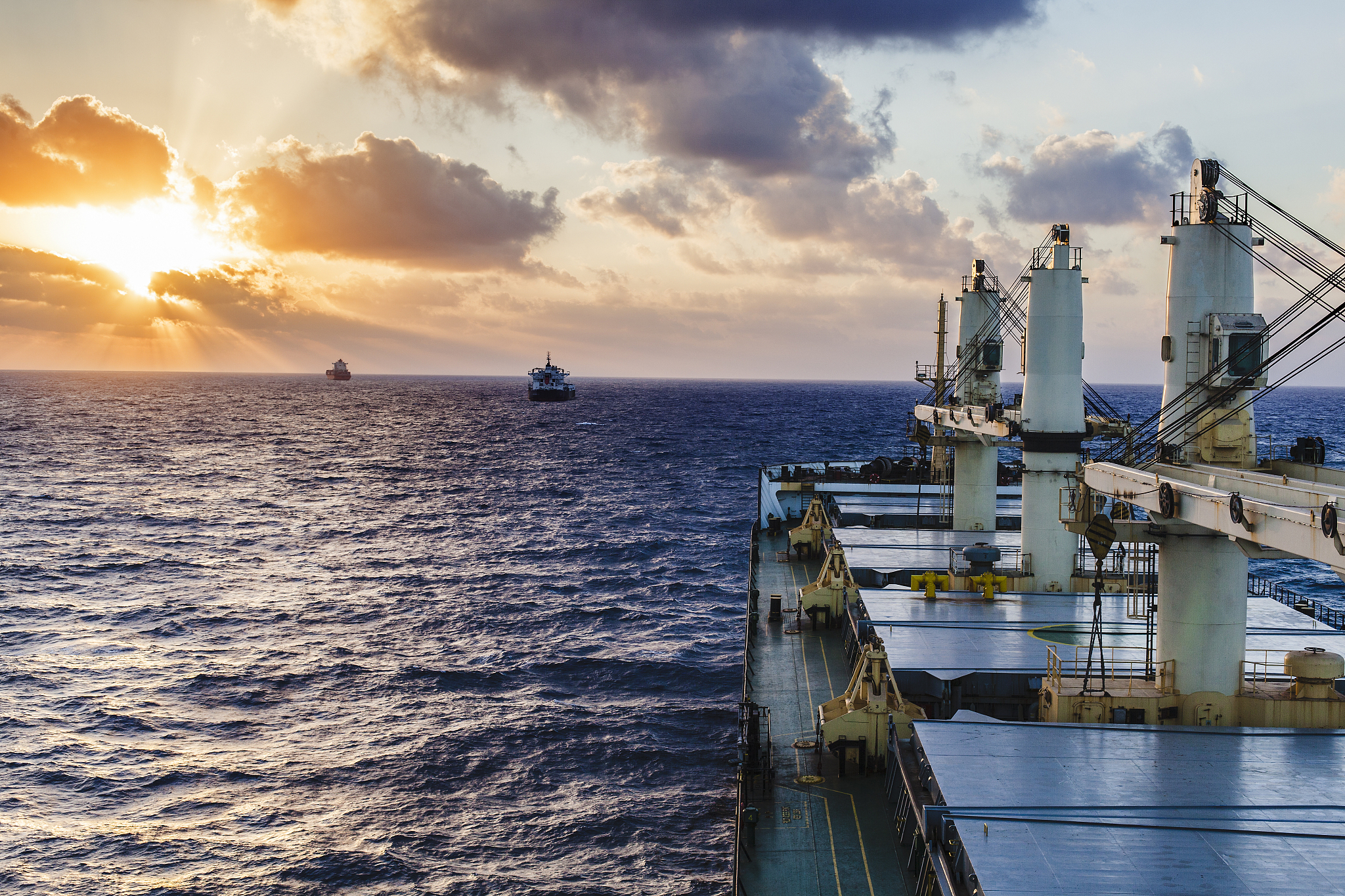 ship underway at sunset