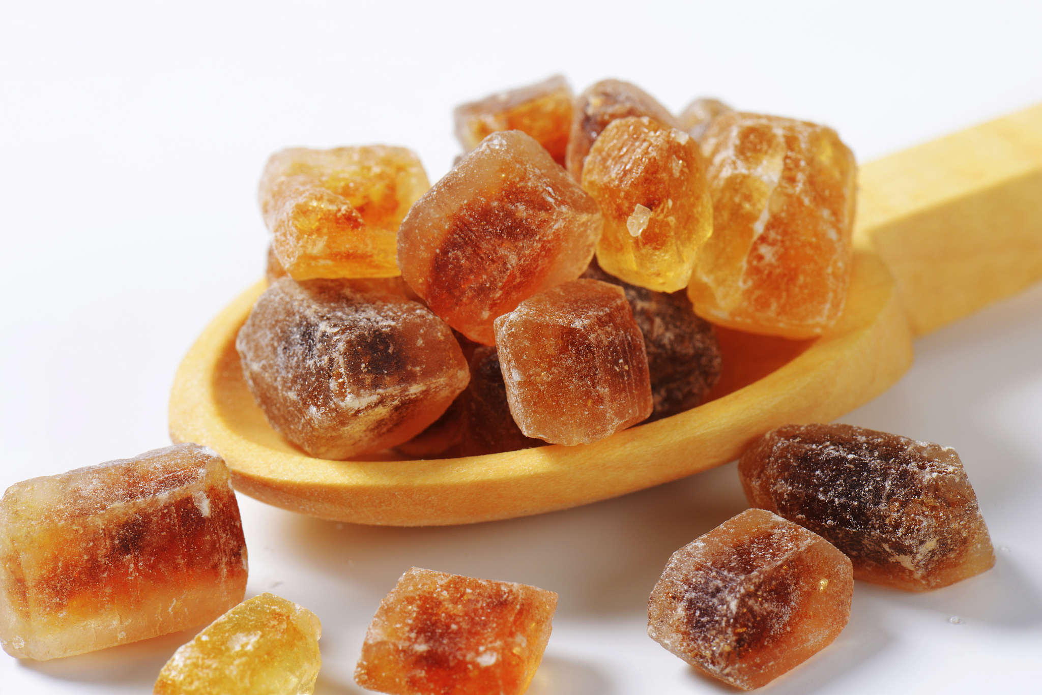 brown rock sugar on spoon