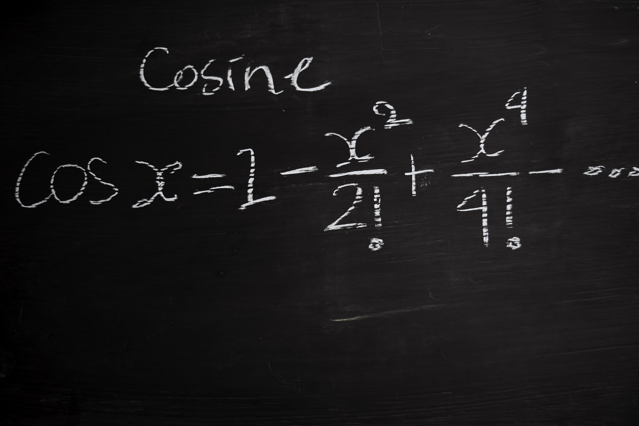 close up math formulas written on a blackboard. education concep