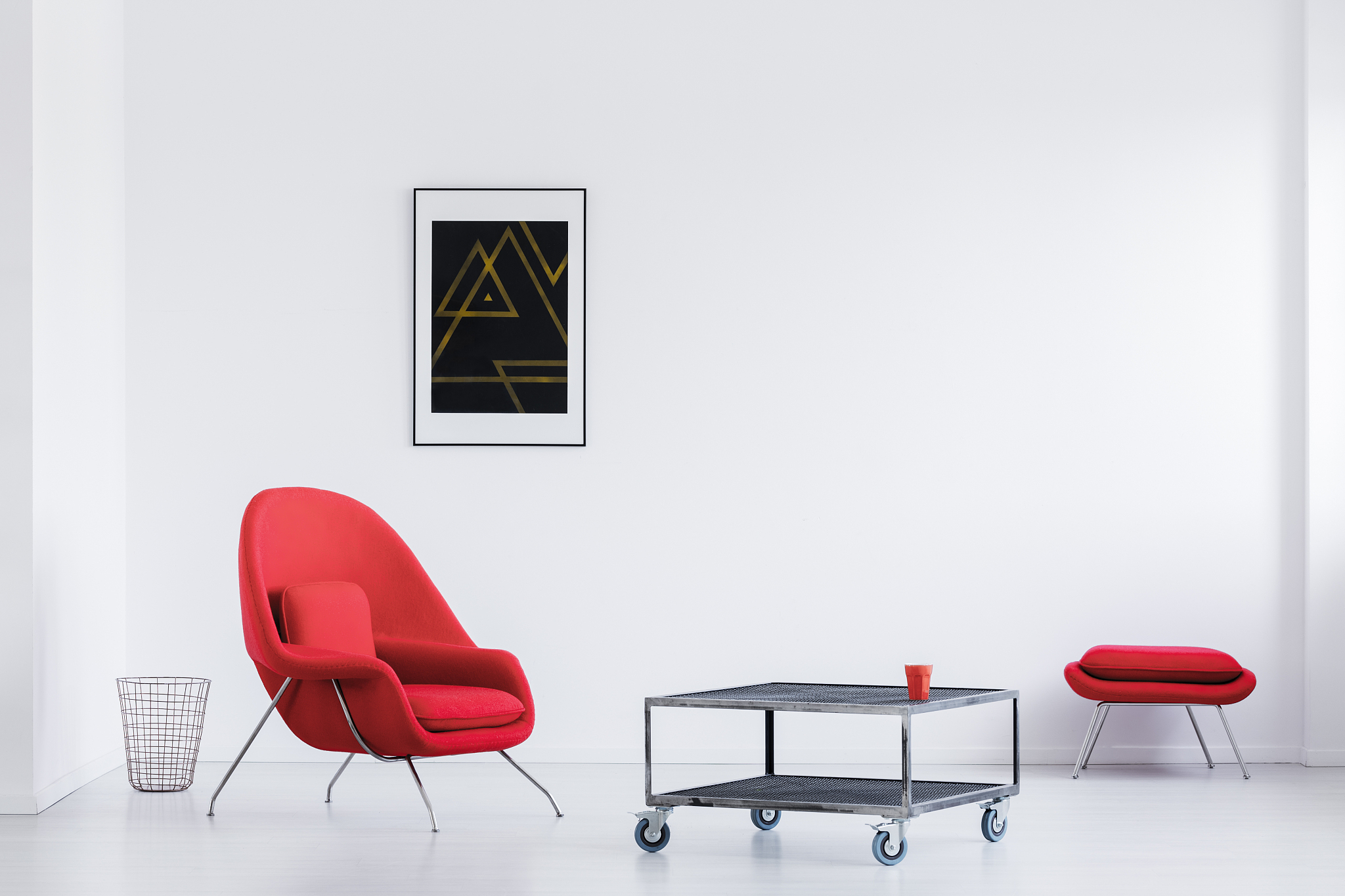 white loft with red armchair