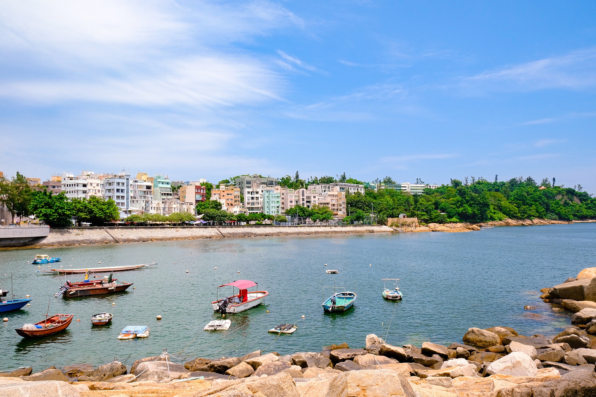 high angle view of sea by buildings against sky