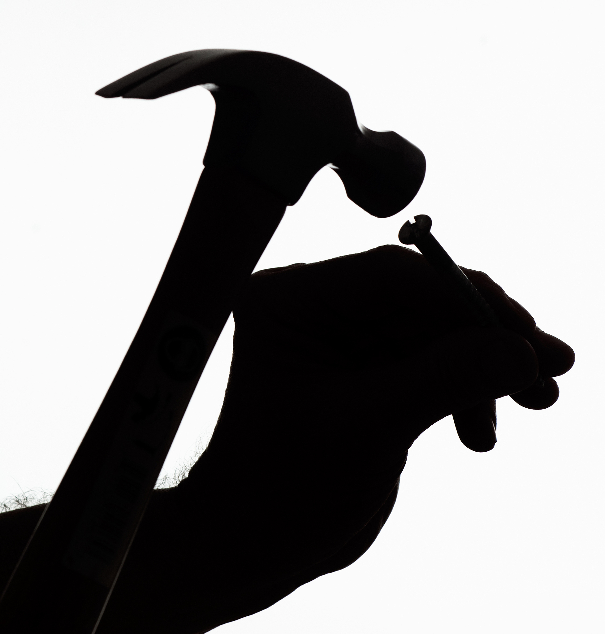 silhouette of hands holding humer and neal