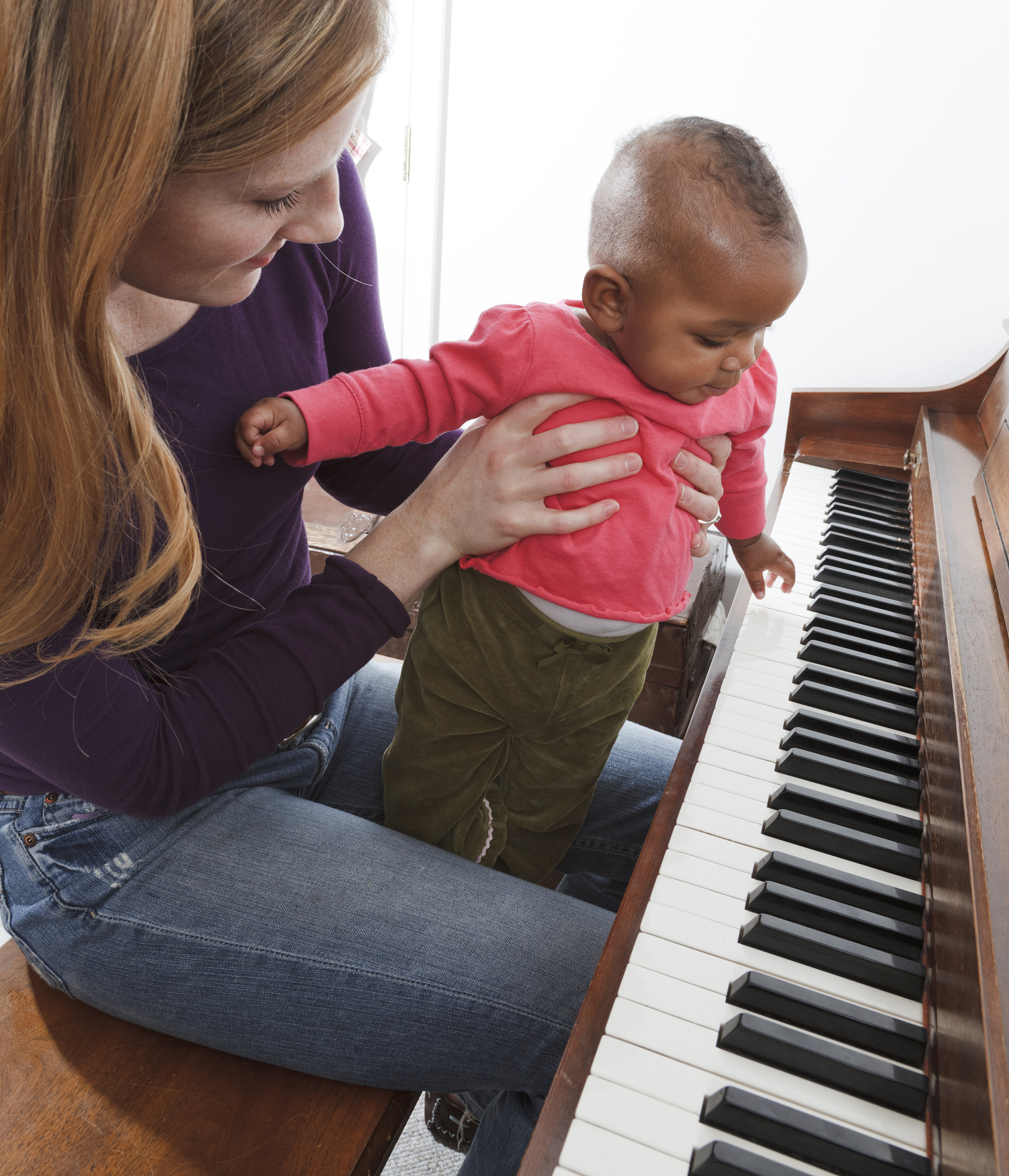 mother, adopted baby african descent multi-ethnic daughter playi
