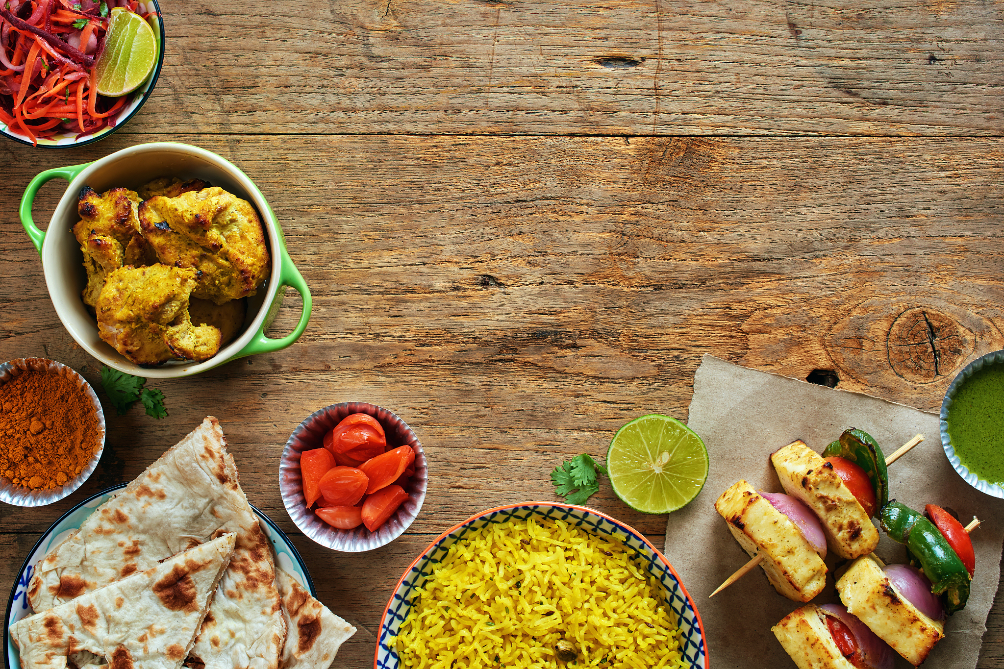 top view of traditional indian dishes on wooden table with copy 