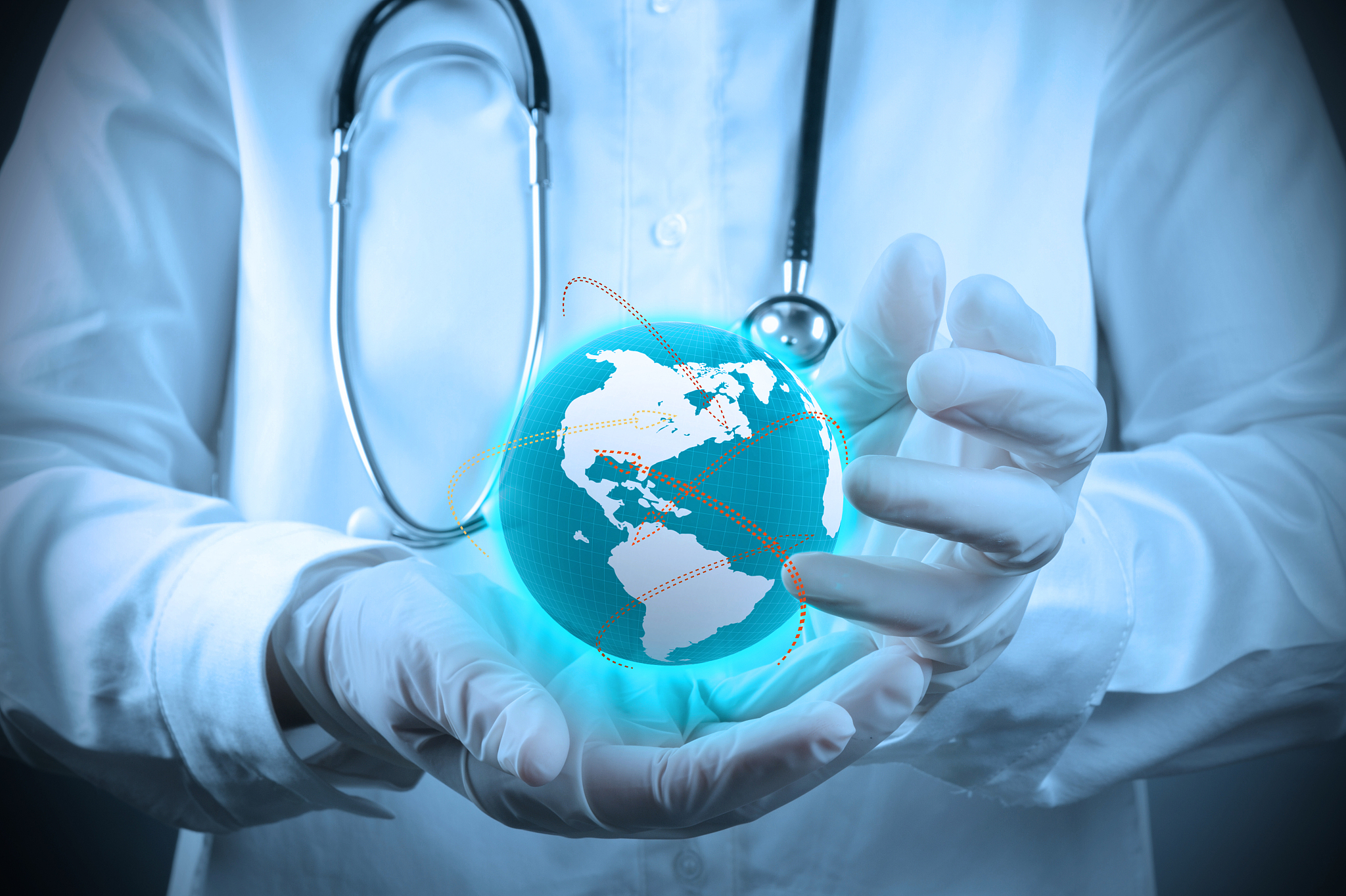 medical doctor holding a world gobe in her hands