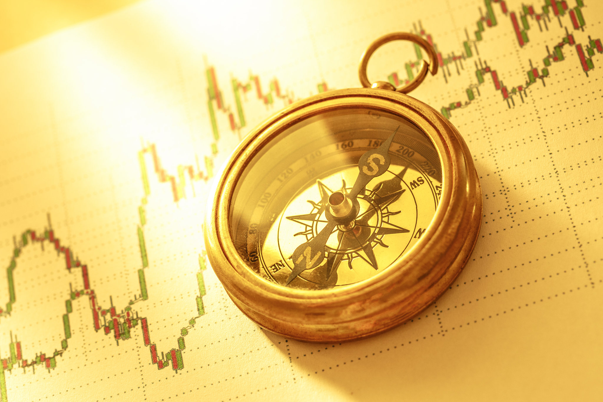 compass on stock market data chart