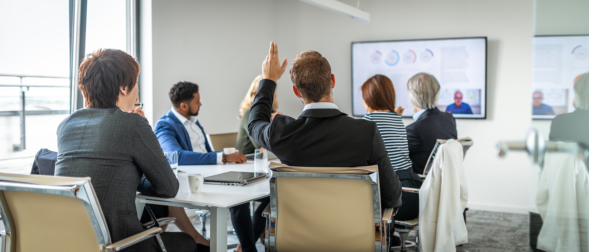 man asking a question during a video conference