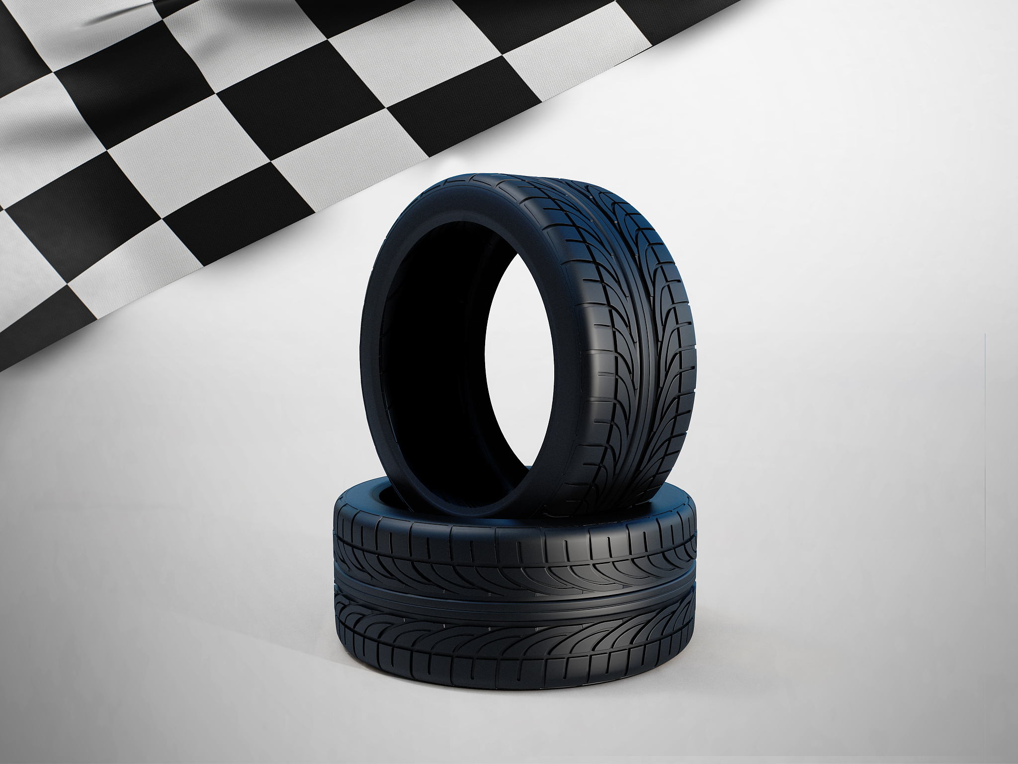 two new car tires withe racing flags on white background.