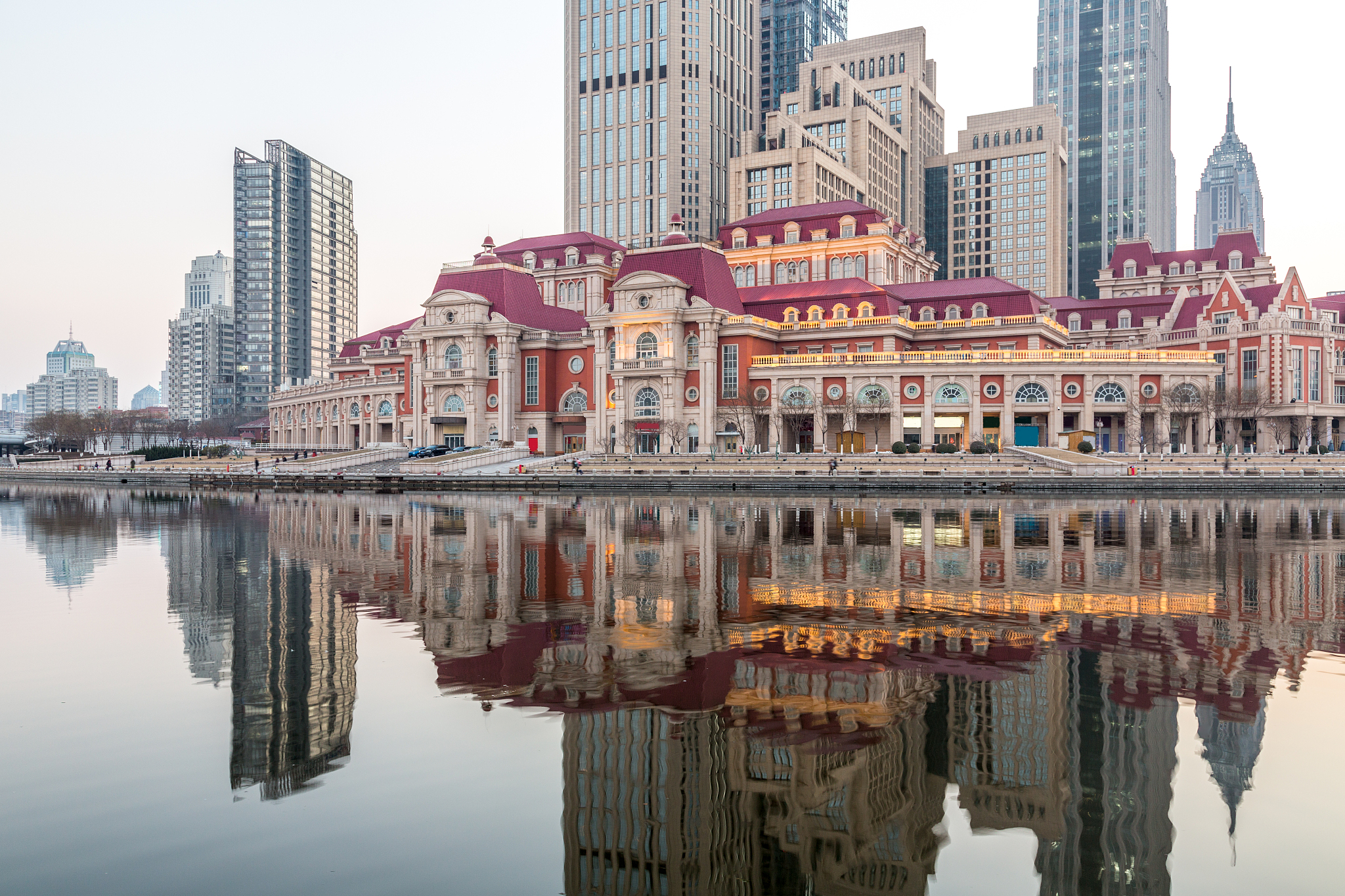 river and modern buildings against sky