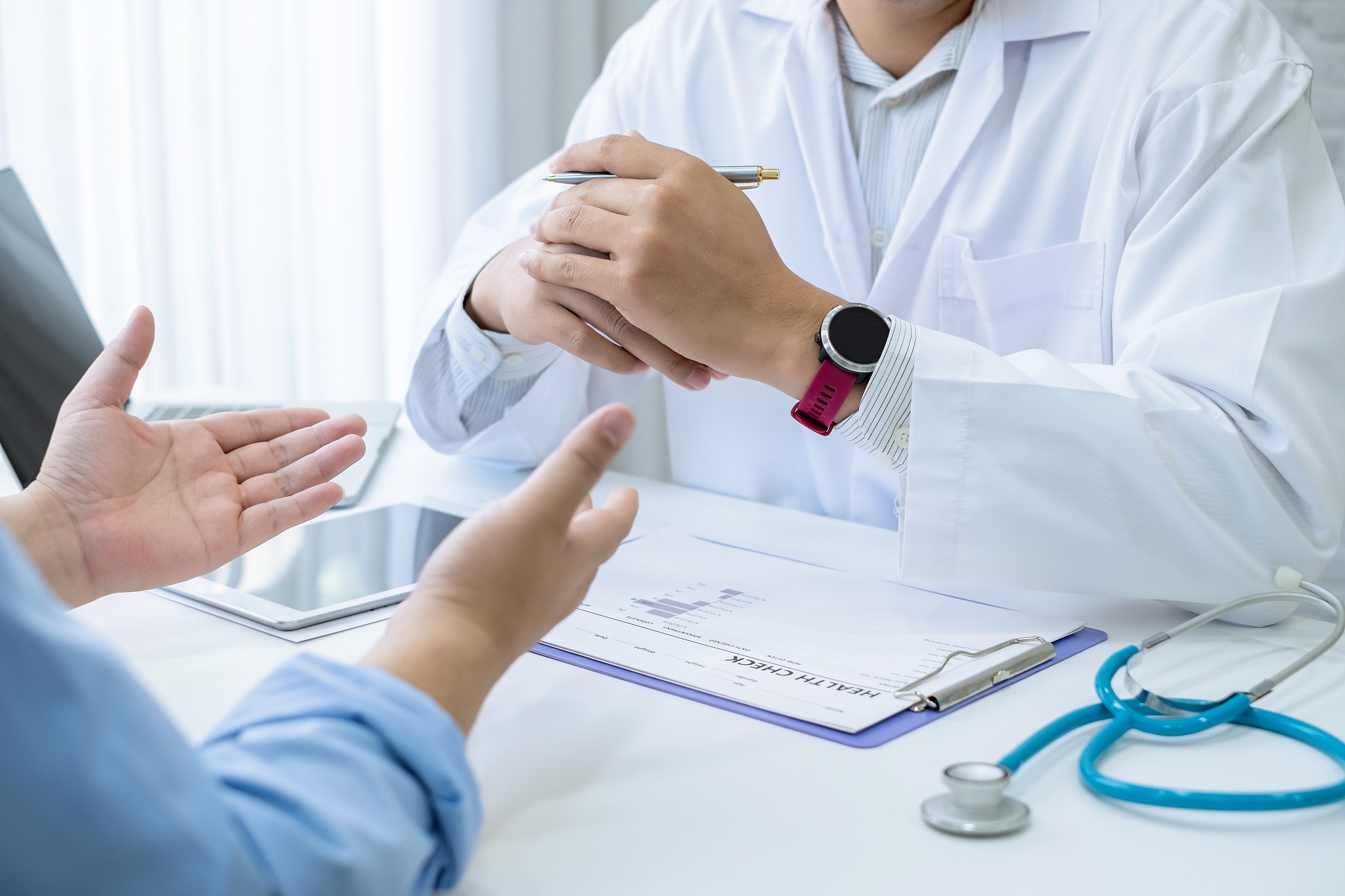 doctor gave advice and talked to the male patient at work.