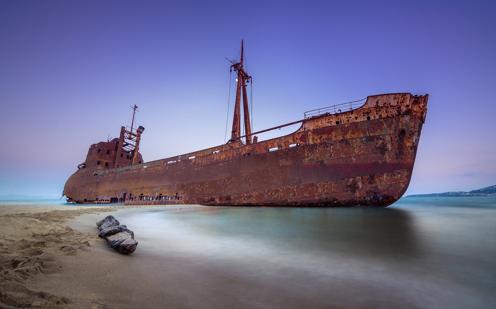 greek coastline with the famous rusty shipwreck in glyfada beach