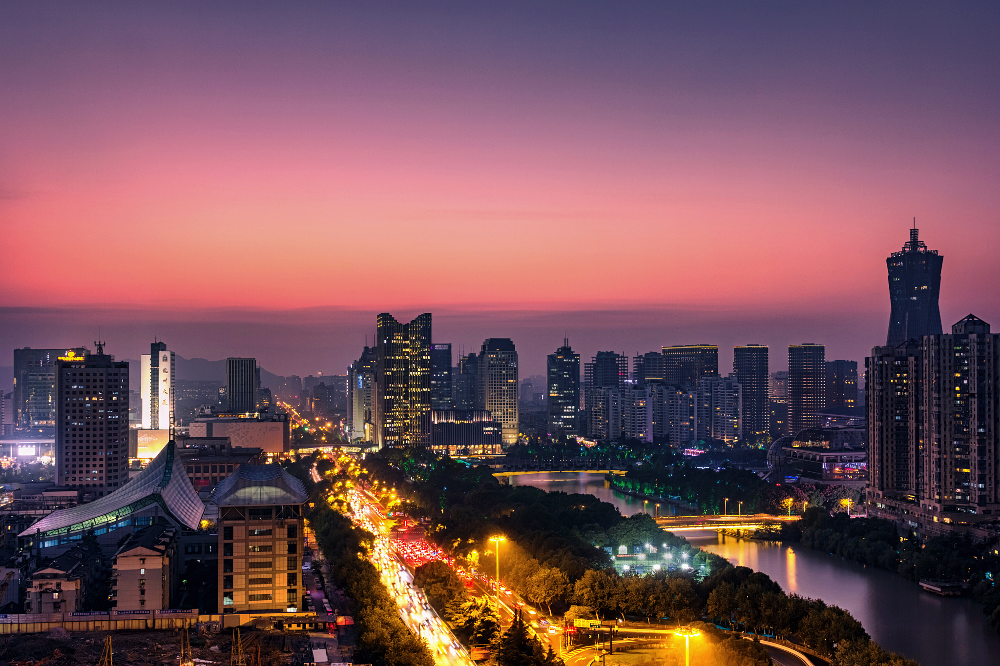 illuminated hangzhou skyline with sunset in background,hangzhou,