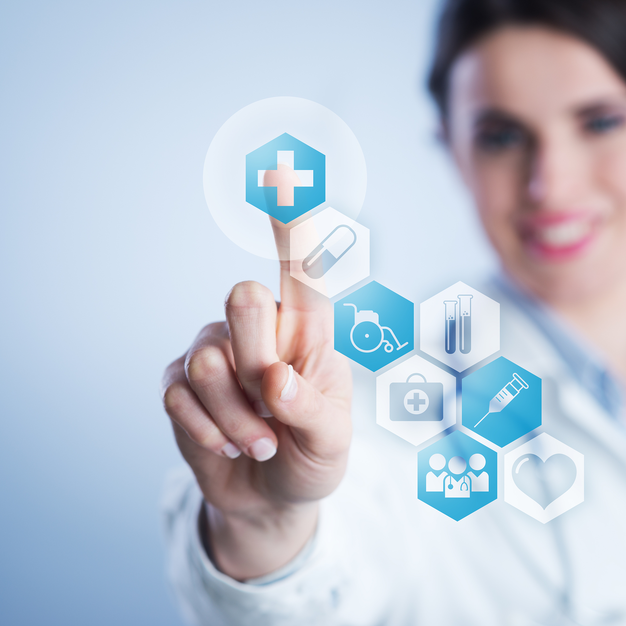 young female doctor using touch screen interface.