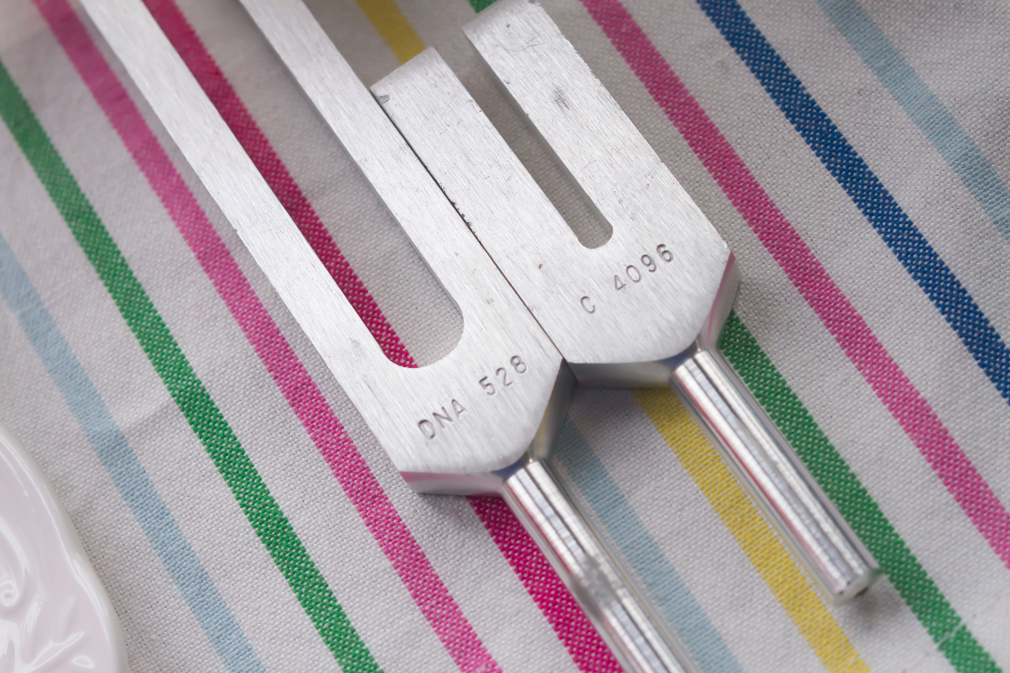 tuning fork and crystal on table .