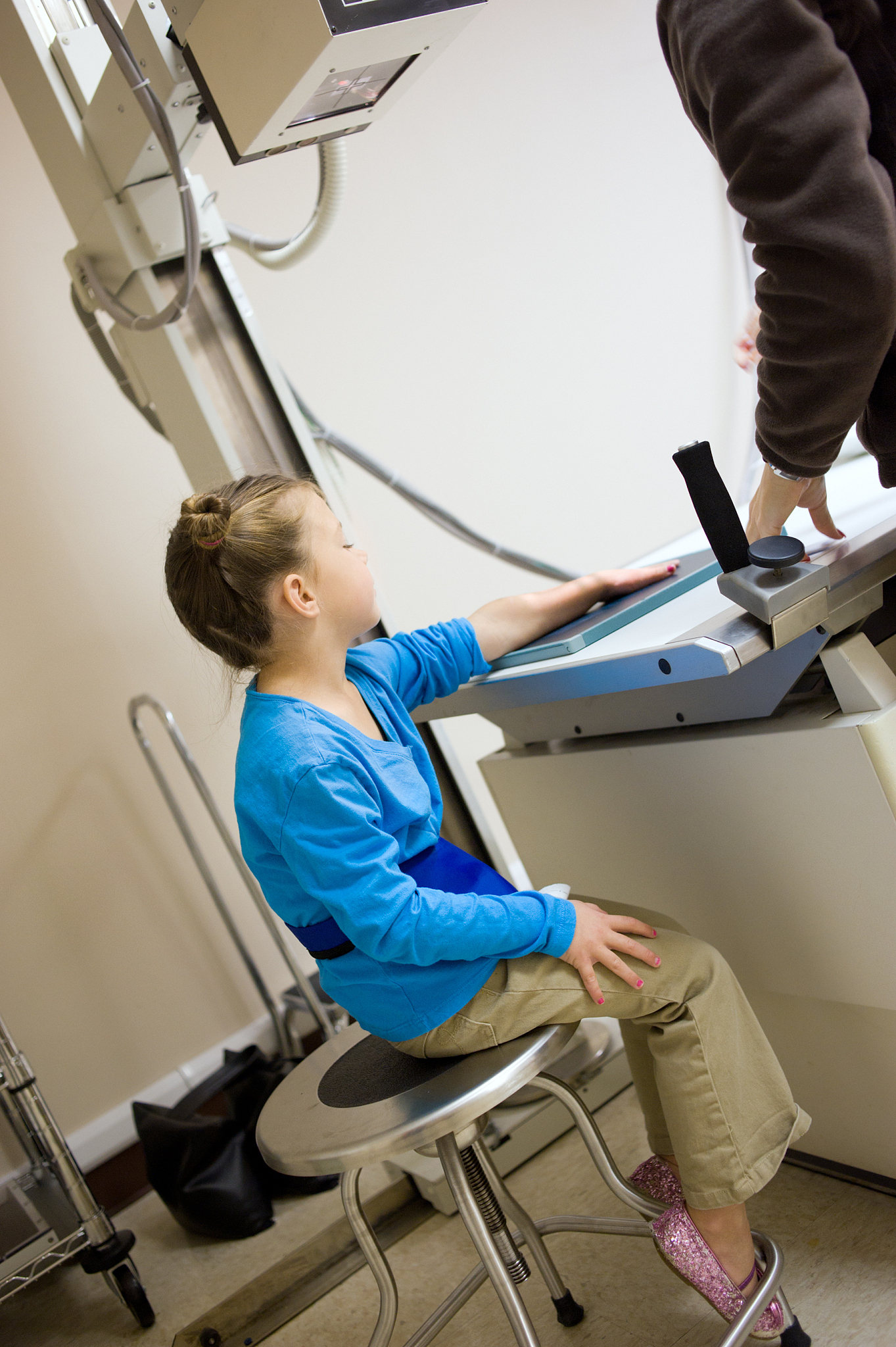 smiling little girl  getting x-ray taken (series)