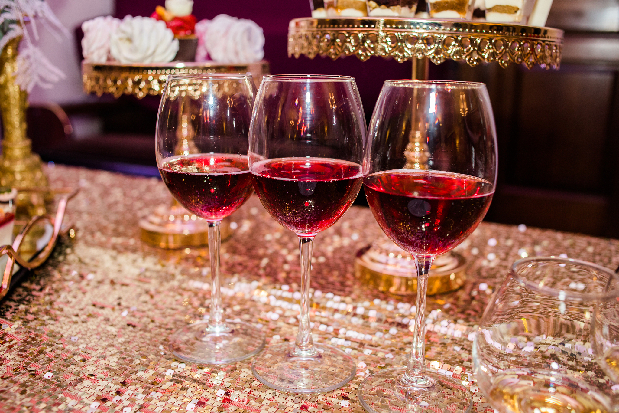 three glasses are full of wine