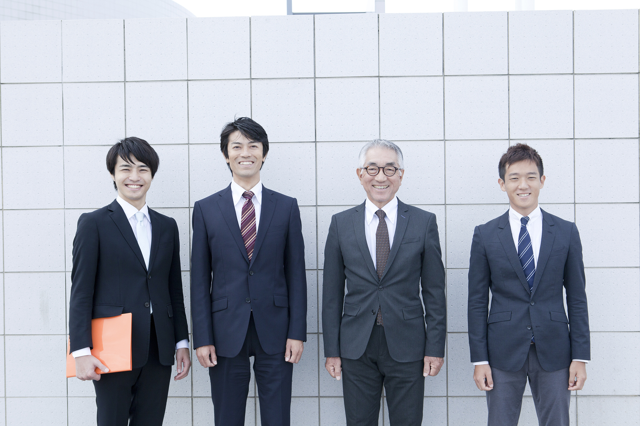 four people standing