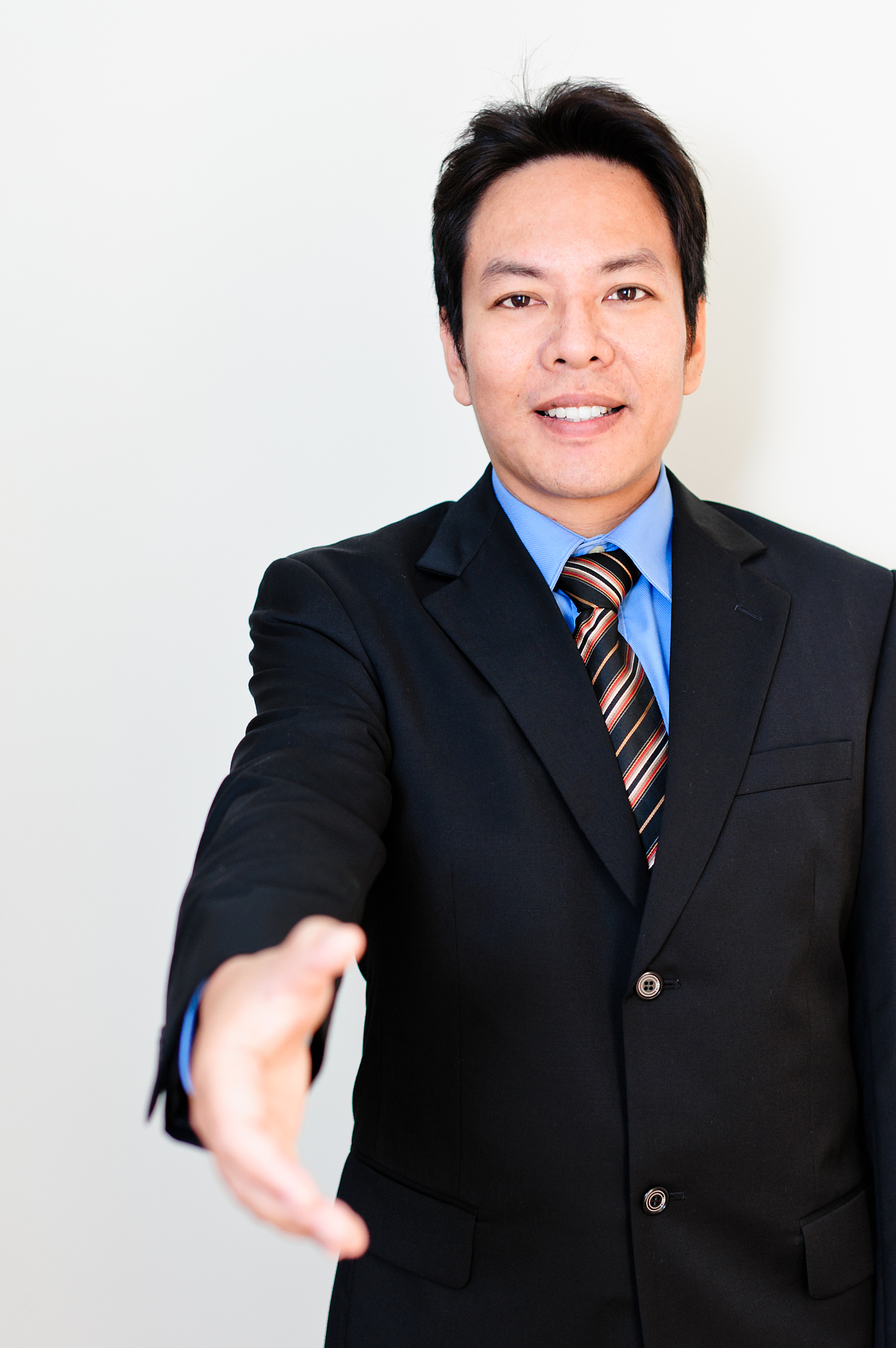 asian business men hand shake.