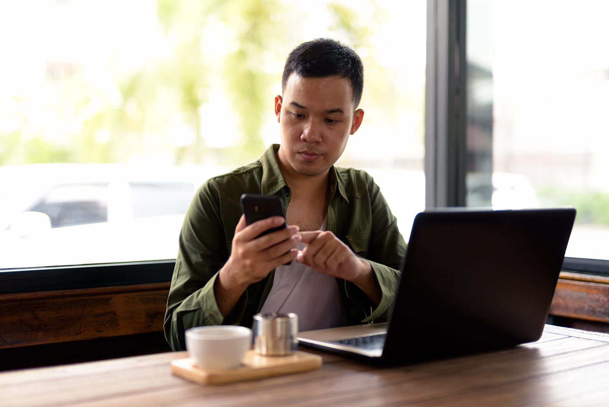 portrait of young asian man in coffee shop